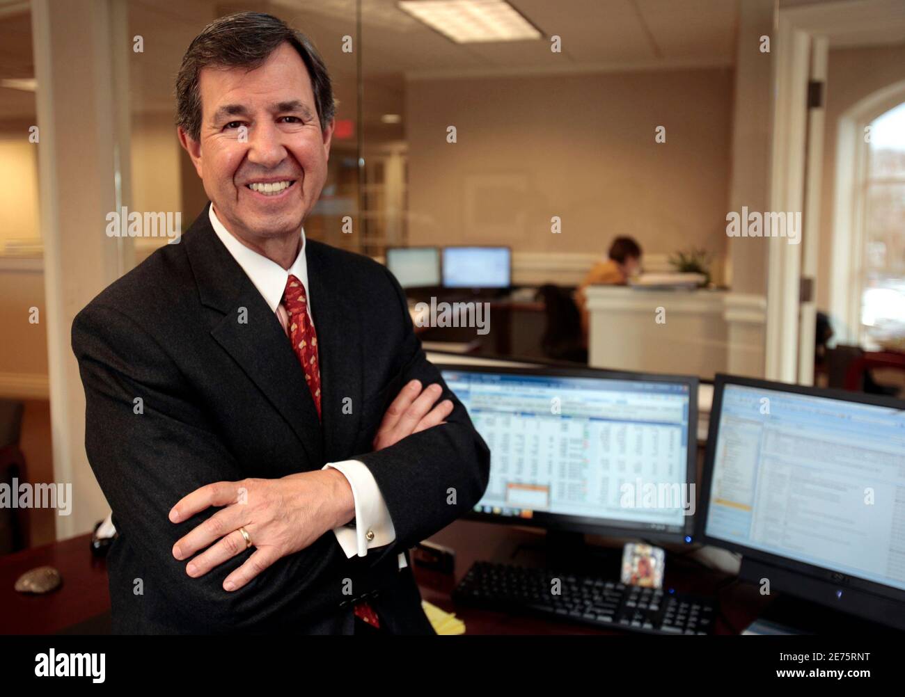Pointe Capital Management LLC managing member Chuck Huebner poses in his  new office at Grosse Pointe Farms, Michigan March 23, 2010. Between  November 2008 and last month, some 1,500 brokers fled 