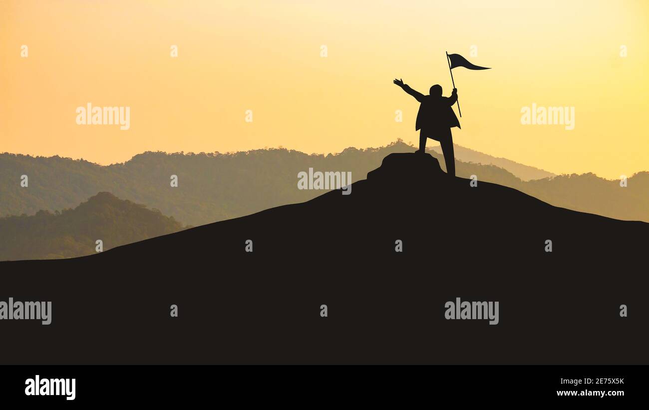 Man standing on top of a mountain holding a flag hi-res stock ...