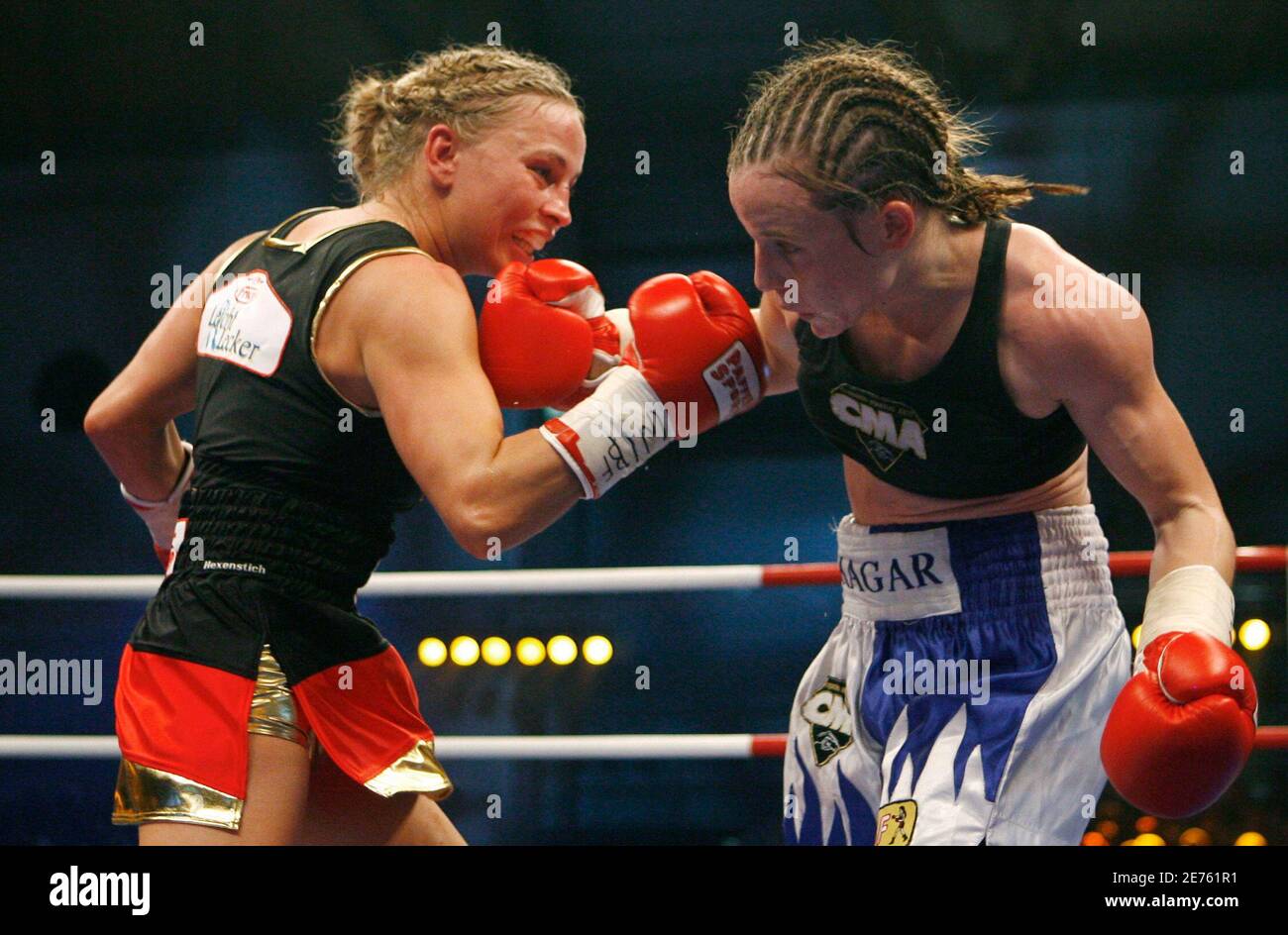 German Regina Halmich (L) punches Hagar Shmoulefeld Finer of Israel during  their WIBF Flyweight Championship boxing fight in Karlsruhe November 30,  2007. Halmich retired after the fight. REUTERS/Alex Grimm (GERMANY Stock  Photo -