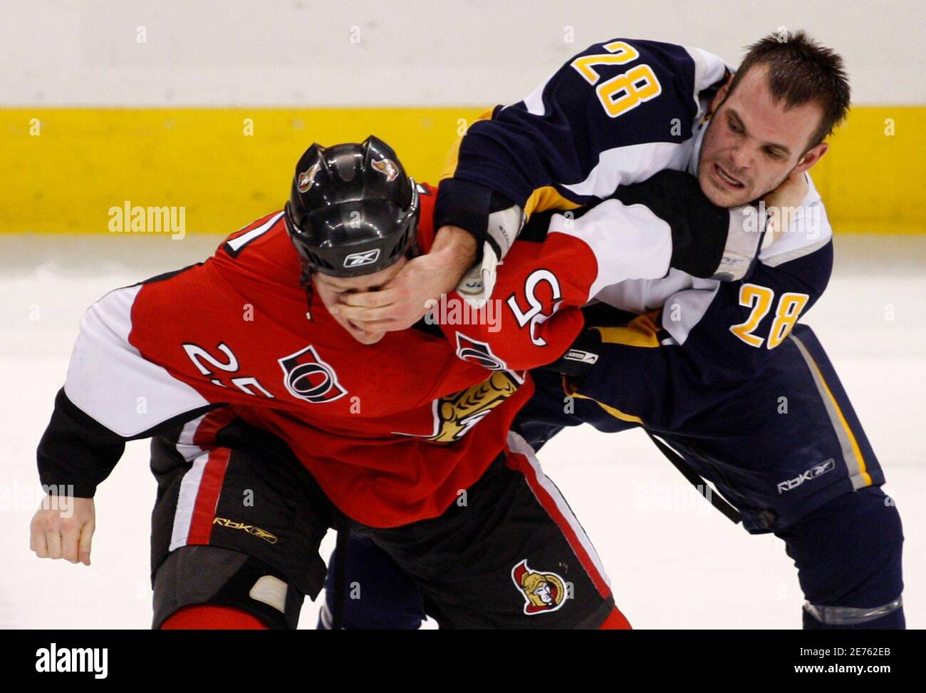 Buffalo Sabres Paul Gaustad (R) fights with Ottawa Senators Chris Neil during the first period of their NHL hockey game in Ottawa January 10, 2008.       REUTERS/Chris Wattie       (CANADA) Stock Photo