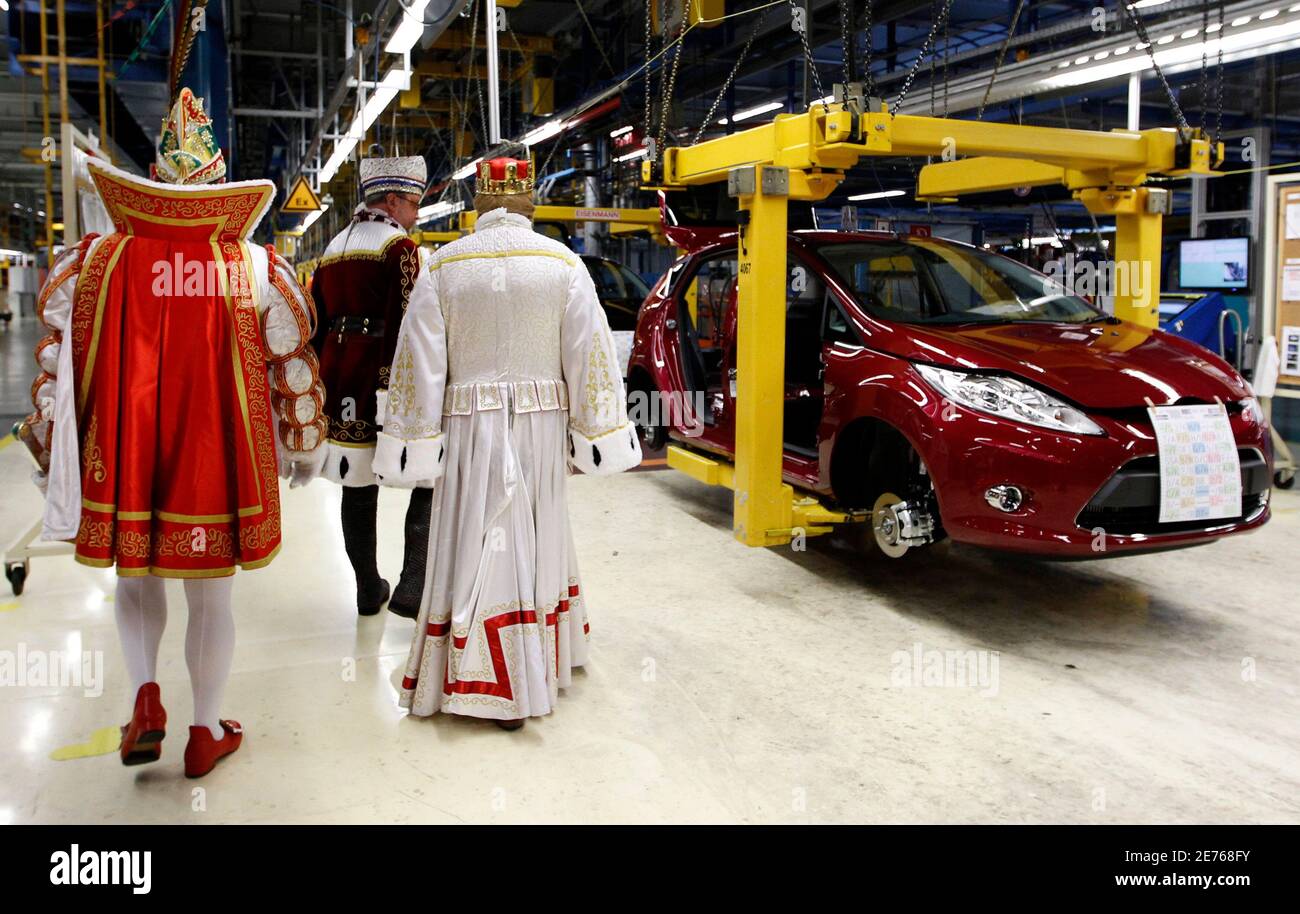The Cologne carnival triumvirate 'Dreigestirn' visits the Cologne plant of the Ford Motor Company, January 27, 2010. The Cologne plant is the first Ford assembly facility in the world to build the new generation Ford Fiesta.   REUTERS/Ina Fassbender   (GERMANY - Tags: TRANSPORT EMPLOYMENT BUSINESS SOCIETY) Stock Photo