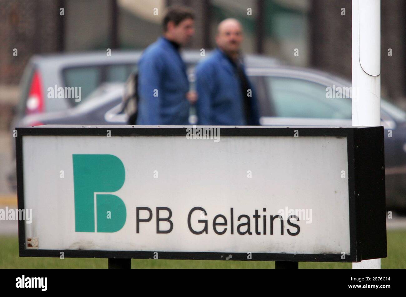 Workers at gelatin producer PB Gelatins walk towards an exit at a plant in  Vilvoorde, near Brussels, January 30, 2006. PB Gelatins is one of the  companies being investigated for dioxin traces
