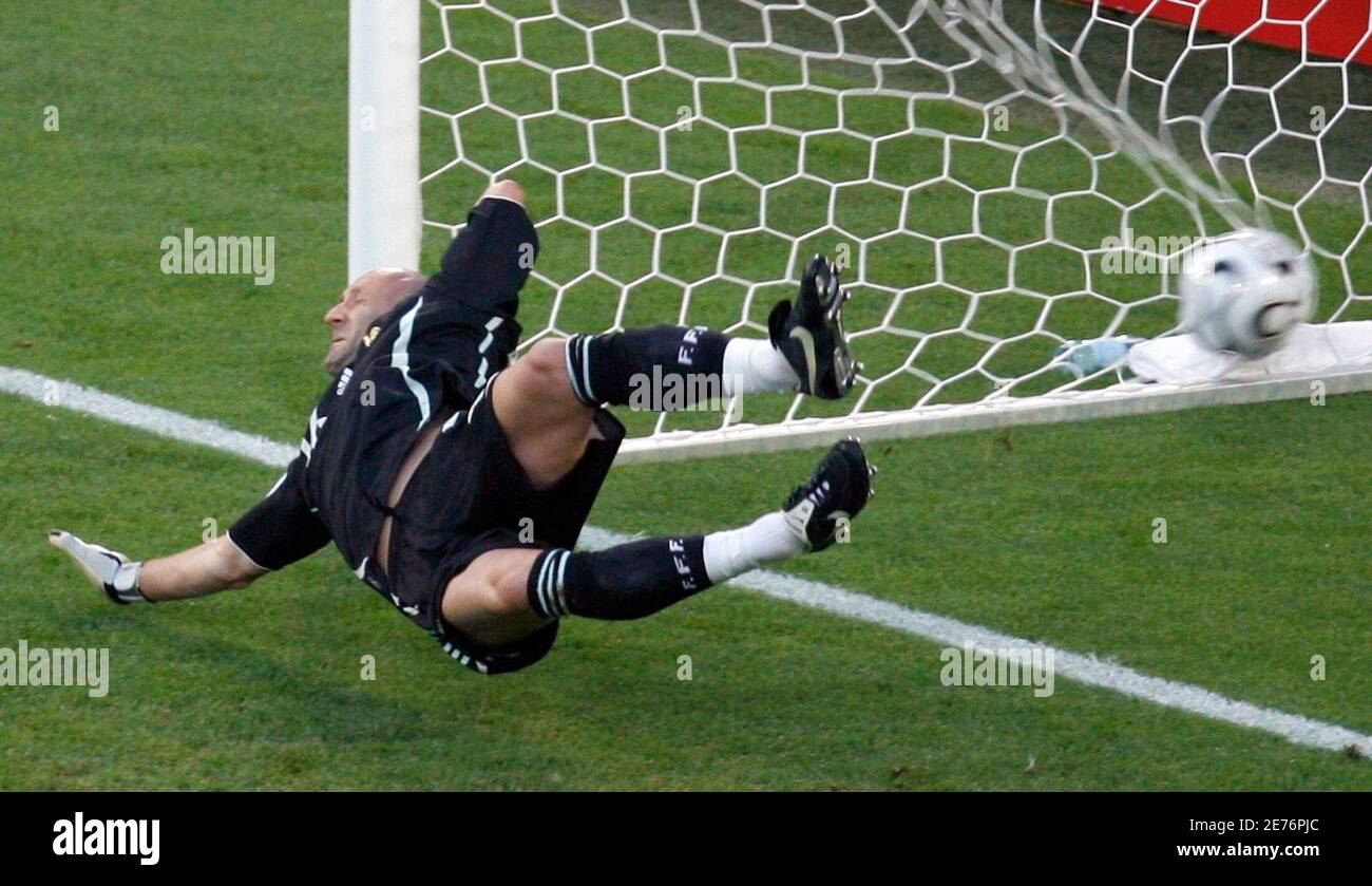 France S Goalkeeper Fabien Barthez Dives For The Ball As Spain S David Villa Not In Picture Scores His Team S First Goal Against France During Their Second Round World Cup 06 Soccer Match In