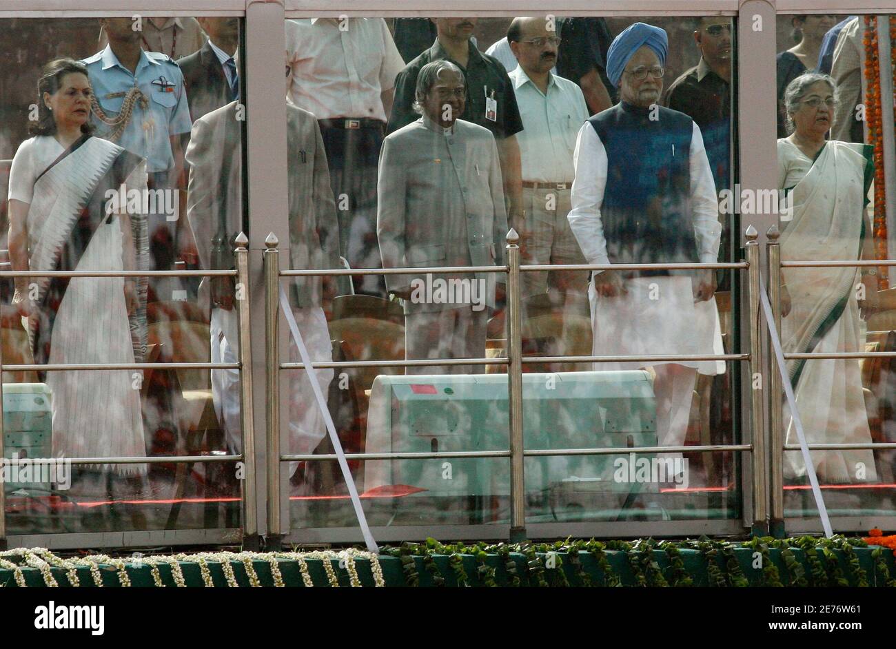 (From L - R) Chief of India's ruling Congress party Sonia Gandhi, Indian President A. P. J. Abdul Kalam, Indian Prime Minister Manmohan Singh and his wife Gursharan Kaur stand behind a bulletproof glass during the celebrations to mark the 150th anniversary of its First War of Independence against British rule at the historic Red Fort in New Delhi May 11, 2007. India celebrated the 150th anniversary of its First War of Independence against British rule on Friday, poking fun at its former colonial rulers at a historic fort in the capital which saw much bloodshed on both sides. The festivities ce Stock Photo