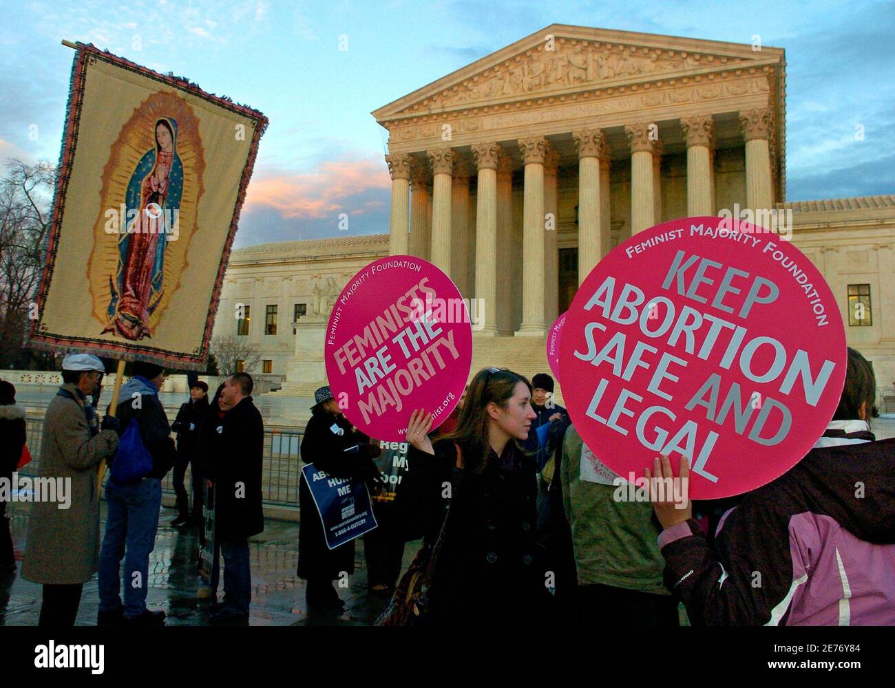 Abortion rights demonstrators (R) share the plaza with pro-life demonstrators (L) in front of the US Supreme Court to mark the 35th anniversary of Roe vs Wade, the landmark legislation which allowed abortion rights, during a rally in Washington January 22, 2008.      REUTERS/Mike Theiler  (UNITED STATES) Stock Photo