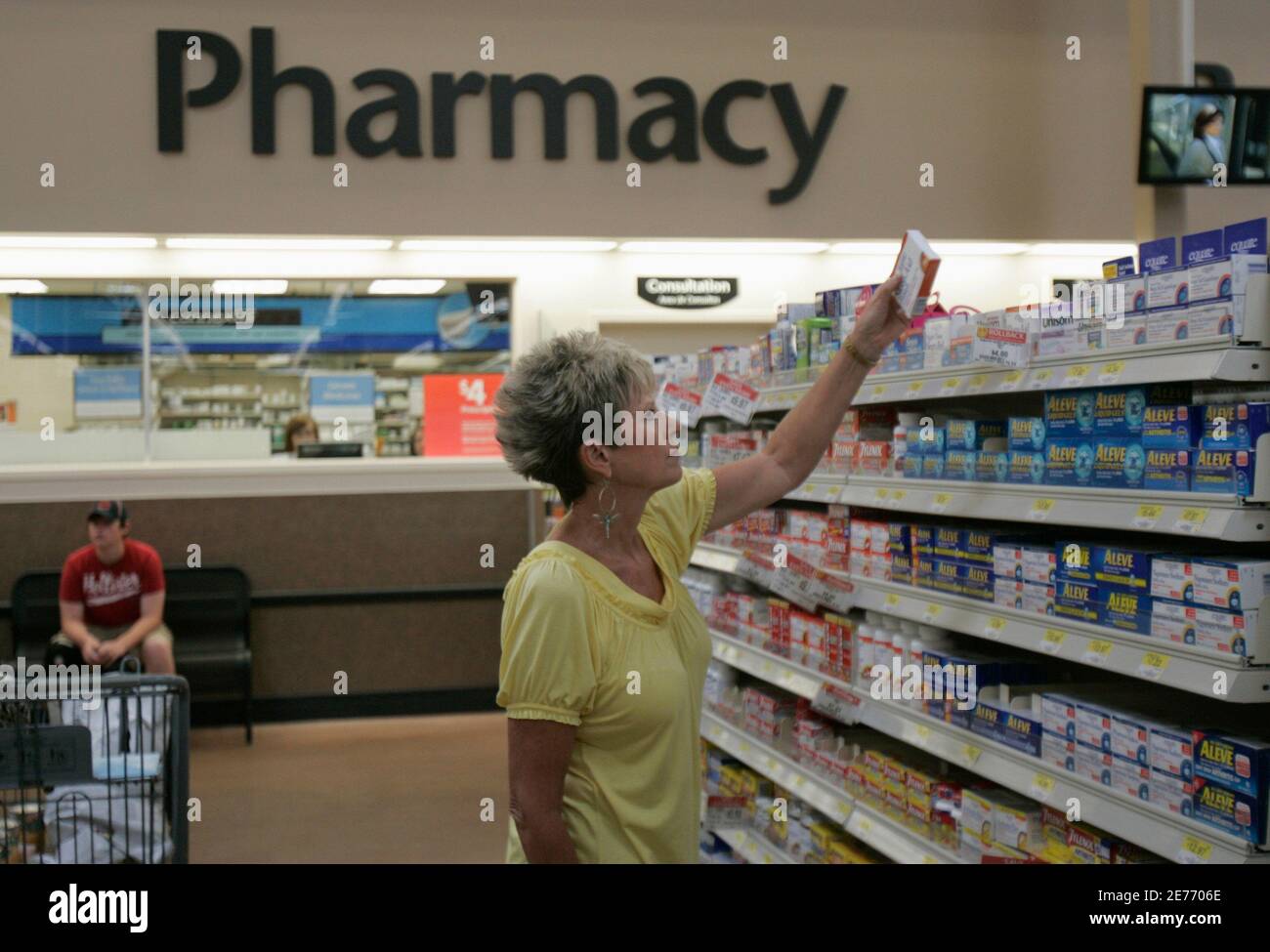 A customer shops for overthecounter medicine at a WalMart