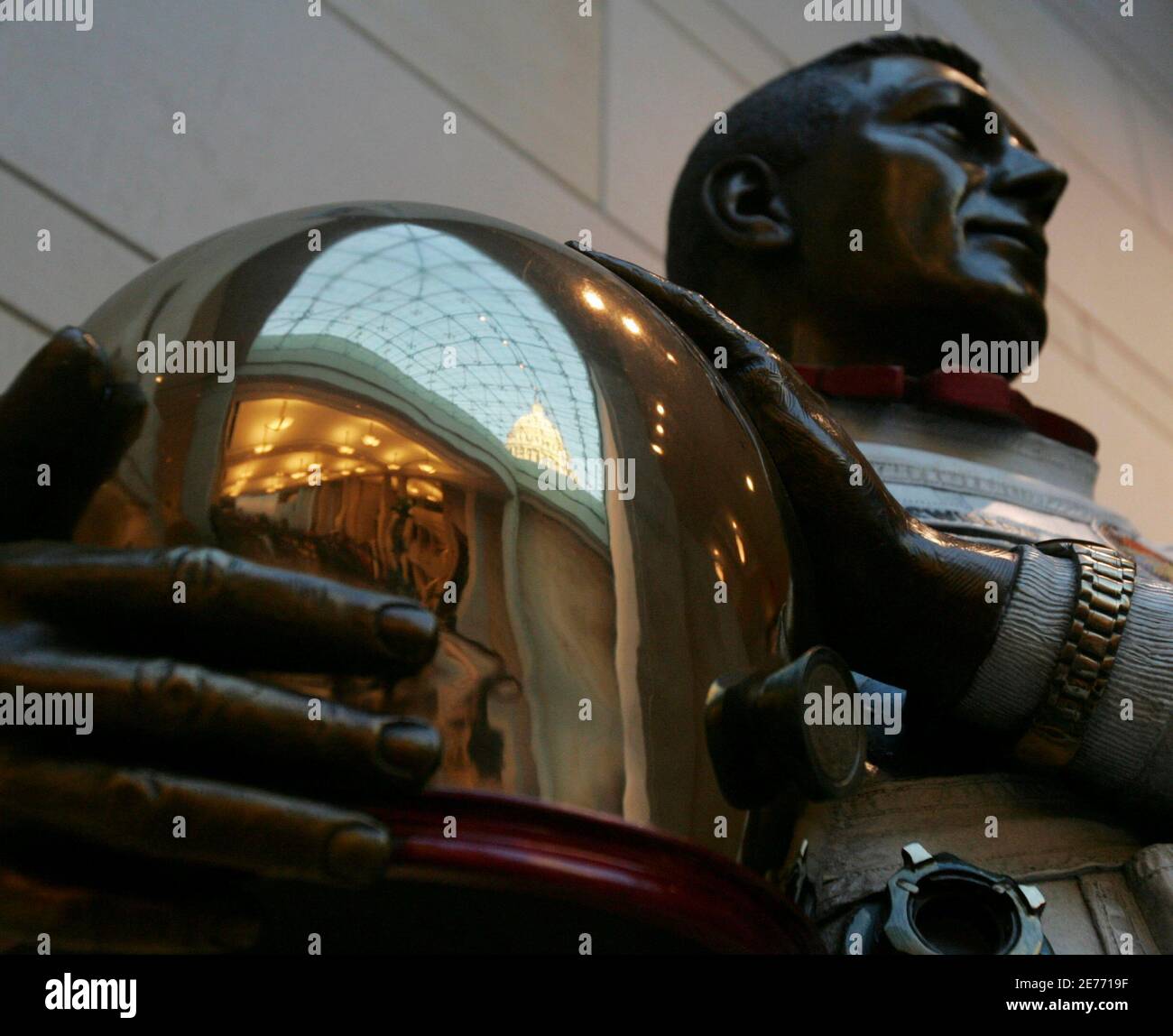 The U.S. Capitol is reflected in a statue of astronaut John Swigert Jr. in the Capitol Visitors Center (CVC) before its opening ceremony in Washington December 2, 2008. The CVC comes after six years of construction and will provide information to visitors of the Capitol. REUTERS/Mitch Dumke (UNITED STATES) REUTERS Stock Photo