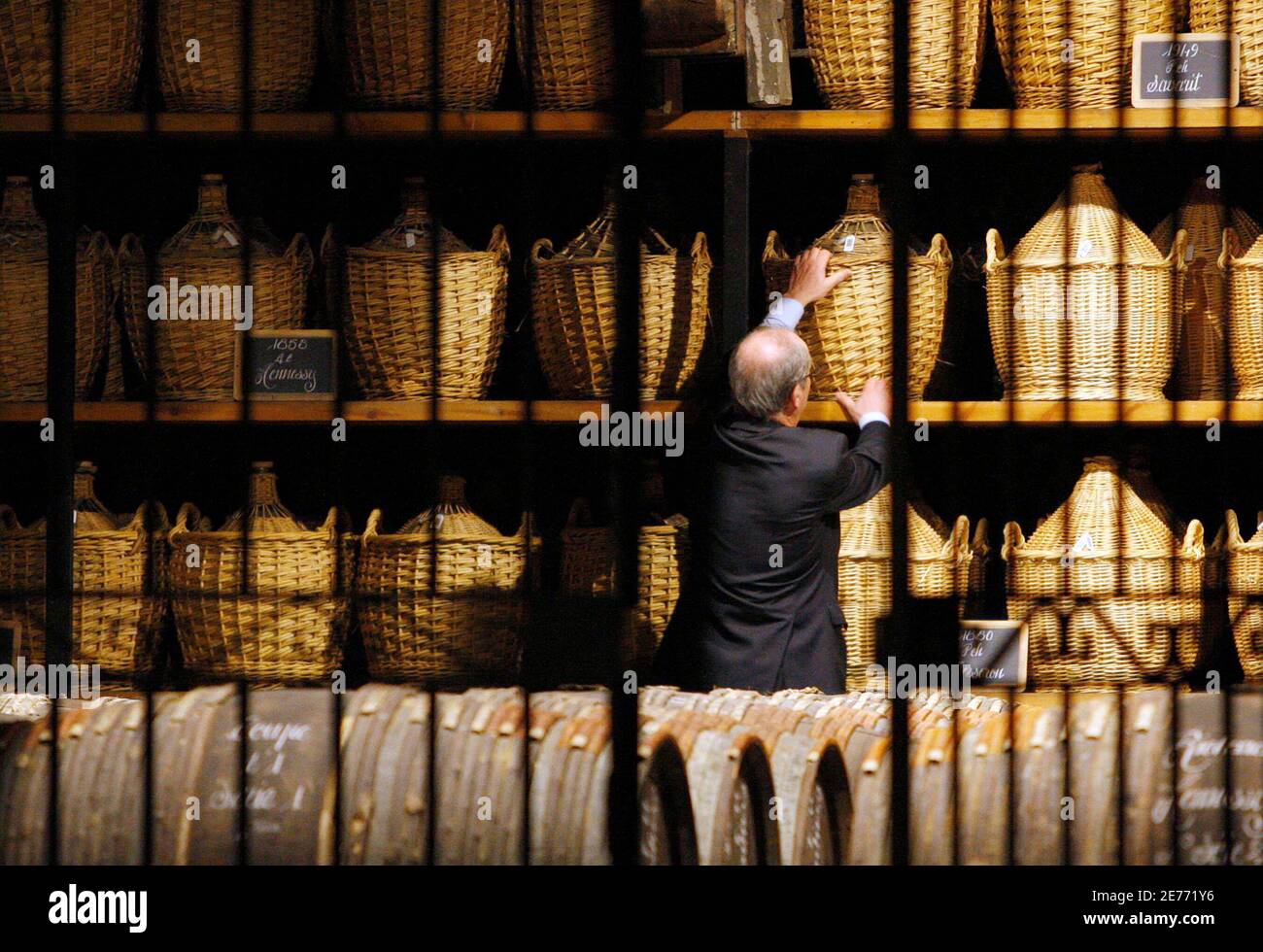 A technical expert inspects a cellar for storing rare and old cognac at