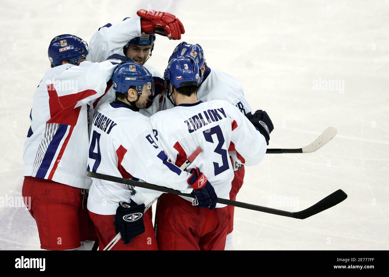 Czech Republic's Marek Zidlicky (R) celebrates with teammates Tomas Kaberle  (L), David Vyborny (2nd L) and Robert Lang (2nd R) after scoring his team's  second goal against Russia during second period play