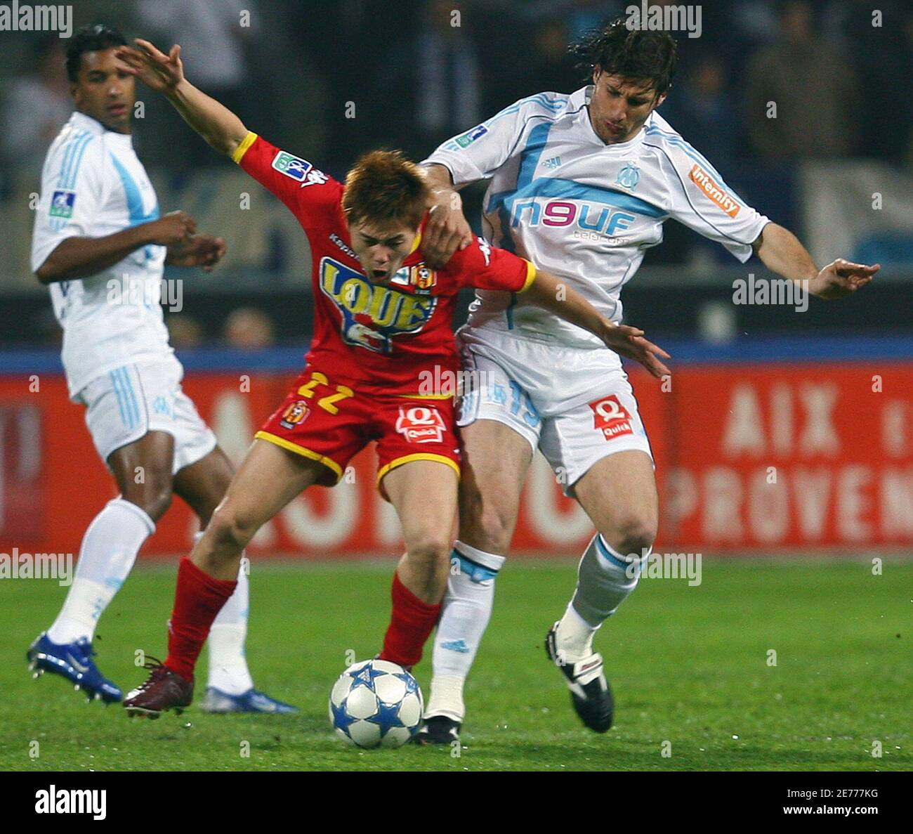 Olympique Marseille's Lorik Cana (R) challenges Japanese Daisuke Matsui Olympique Marseille's Lorik Cana (R) challenges Japanese Daisuke Matsui