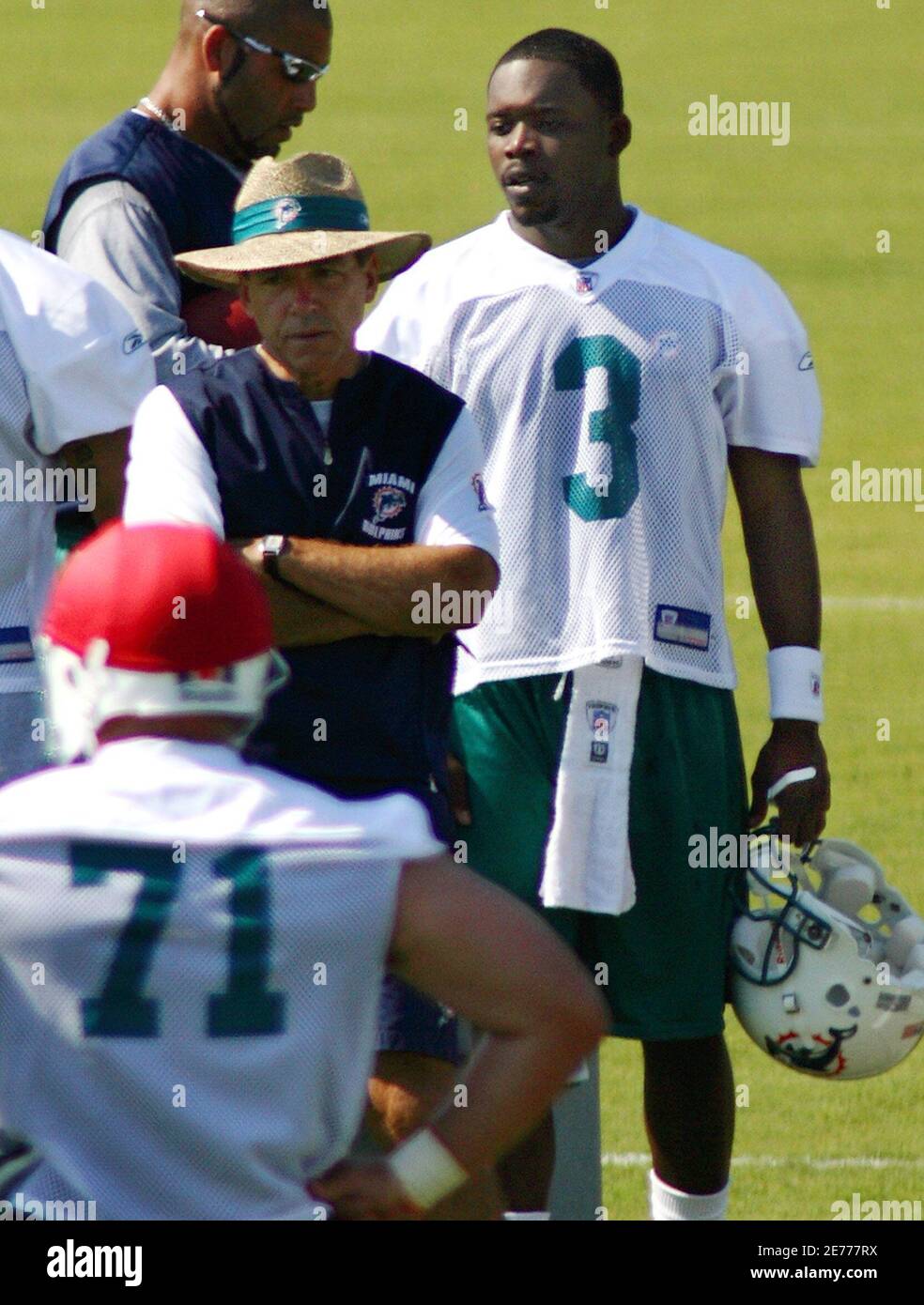 Miami Dolphins head coach Nick Saban (center) stands with rookie un-drafted  quarterback Marcus Vick (3) during mini camp in Davie, Florida, May 5,  2006. Vick is the younger brother of Atlanta Falcons