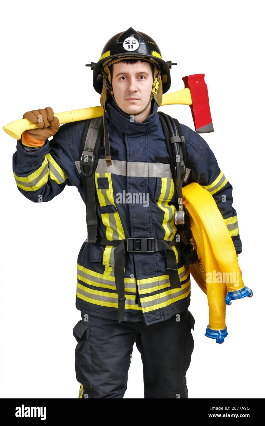 Young man in firefighter uniform and hardhat Stock Photo - Alamy