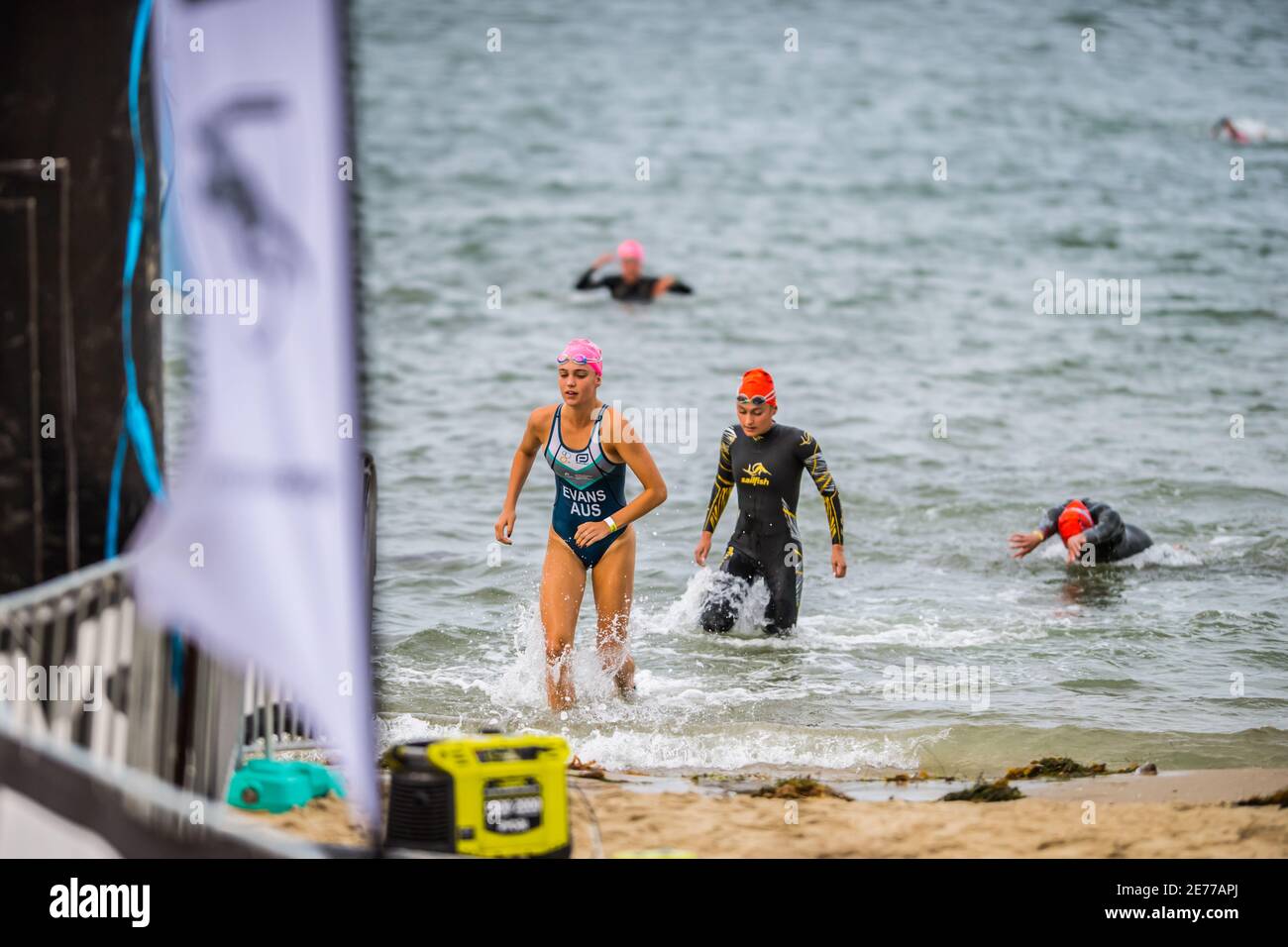 Melbourne, Australia. 17th Jan, 2021. Female triathletes, Ola Evans and Karolina Czajkowska seen exiting the water after a swim race during the 2XU Triathlon Series 2021, Race 1 at St Kilda Beach. Credit: SOPA Images Limited/Alamy Live News Stock Photo