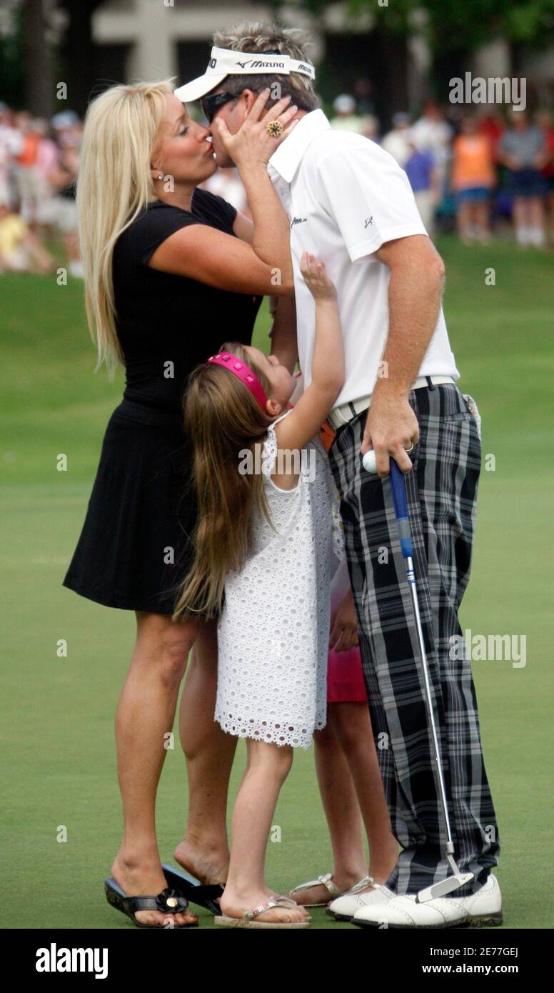 Brian Gay is embraced by his wife Kimberly (L) and daughters Brantley (C), 5, and Makinley, 9, following the final round of the St. Jude Classic golf tournament at TPC Southwind in Memphis, Tennessee June 14, 2009.    REUTERS/Nikki Boertman    (UNITED STATES SPORT GOLF) Stock Photo