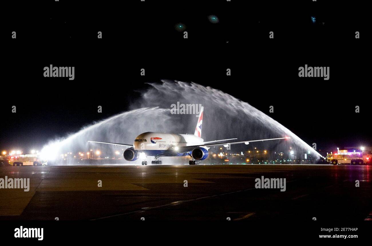 A British Airways' B777 passenger jet is welcomed with a traditional water cannon salute during the arrival of an inaugural flight at McCarran International Airport in Las Vegas, Nevada October 25, 2009. The new daily non-stop service is between London's Heathrow Airport and Las Vegas' McCarran. REUTERS/Las Vegas Sun/Steve Marcus (UNITED STATES TRANSPORT BUSINESS TRAVEL IMAGES OF THE DAY) Stock Photo