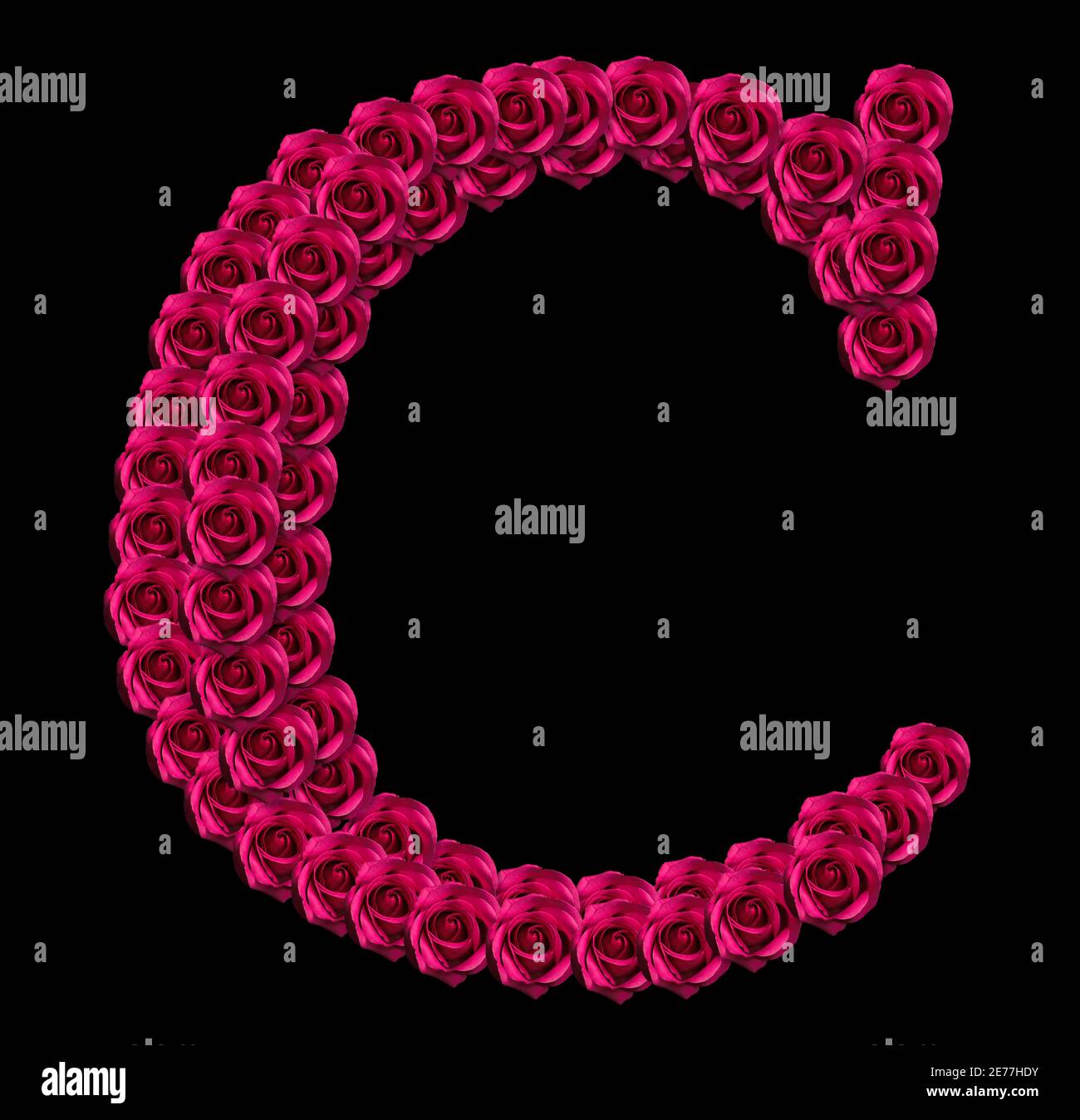 romantic concept image of a capital letter C made of red roses. Isolated on black background. Design element for love or valentines themes Stock Photo