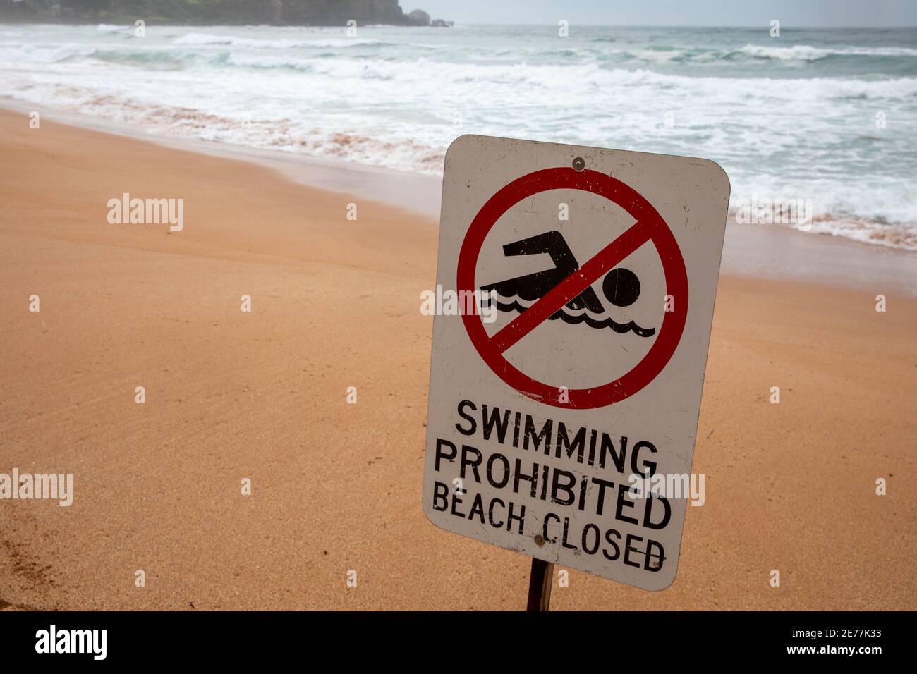 Swimming prohibited beach closed sign at Avalon Beach during dangerous ...