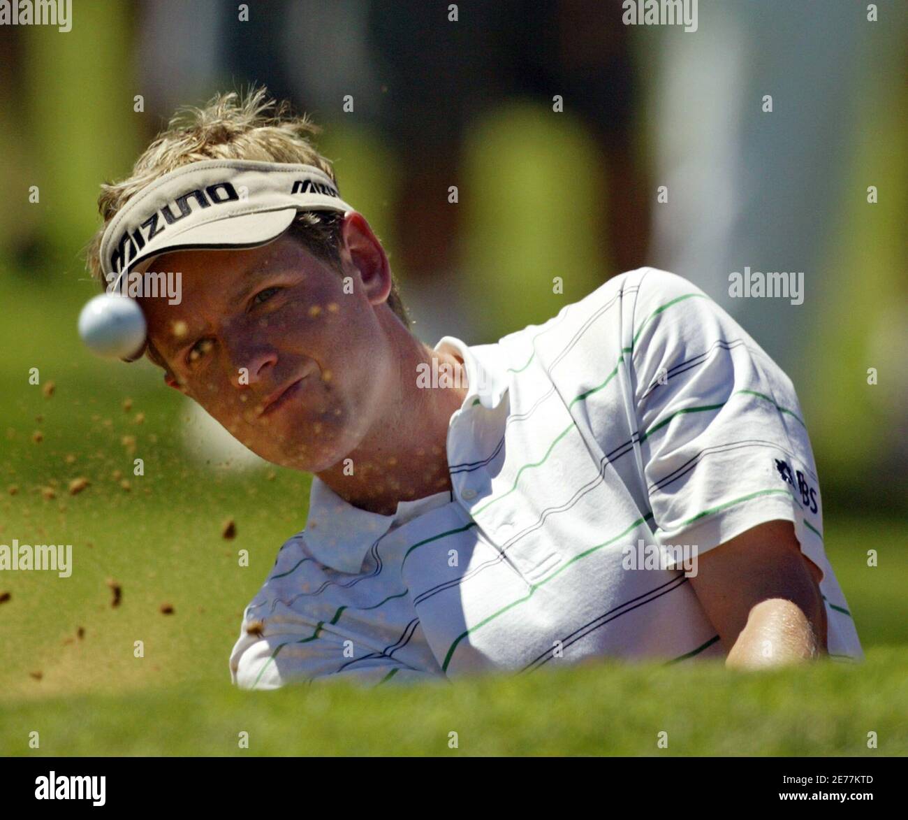 Britain's Luke Donald plays his ball out of a bunker at the third hole during the third round of the $4 million Sun City Golf Challenge in Sun City, west of Johannesburg, in South Africa December 3, 2005. Donald finished three under-par. REUTERS/Juda Ngwenya Stock Photo