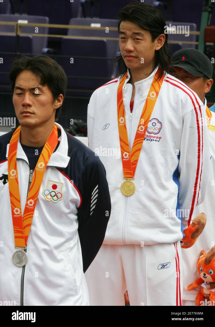 Taiwan S Wang Yeu Tzuoo R And Japan S Matsui Toshihide Stand On The Podium After Competing In The Men S Single Tennis Final At The East Asian Games In Macau China November 4 05 Wang