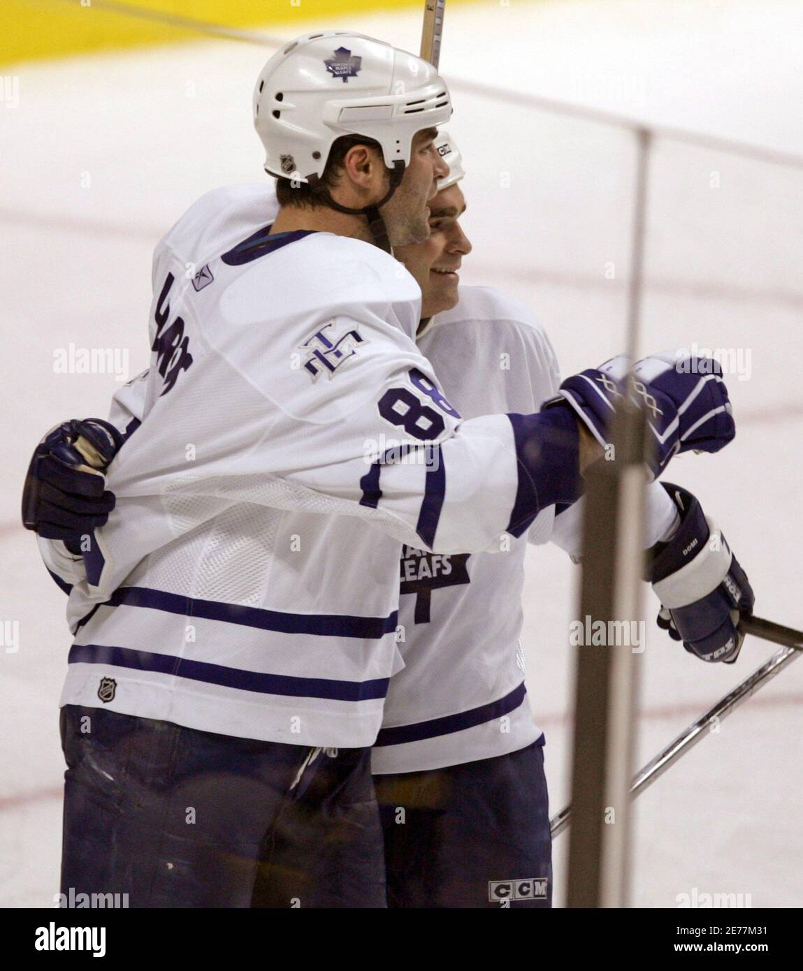 Toronto Maple Leafs Tie Domi (R) congratulates teammate Eric Lindros after  Lindros scored a goal during third period play in their NHL game in Boston  November 17, 2005. The Maple Leafs won