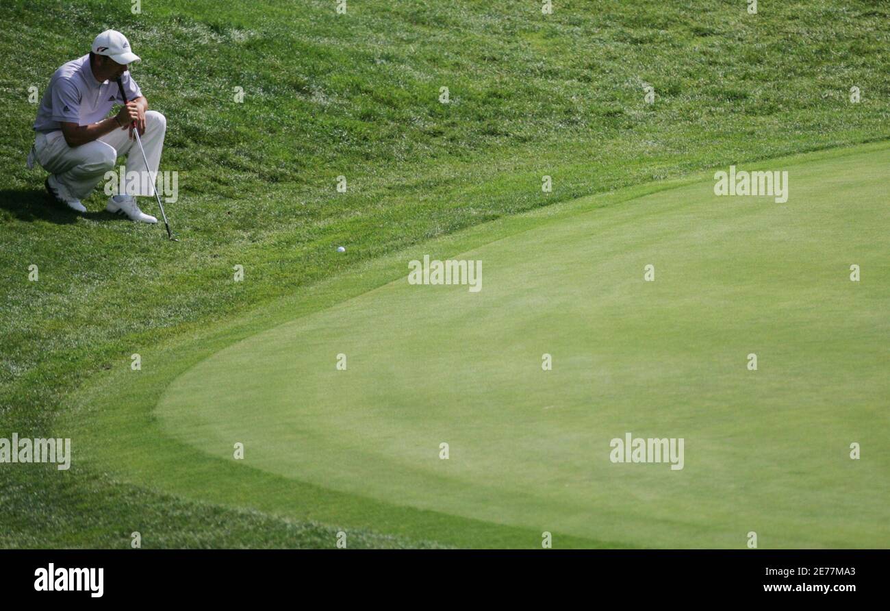 Garcia of Spain checks out the ball position for the putt on the twelfth  green during the third round of the European Masters golf tournament in  Crans-Montana. Sergio Garcia of Spain checks