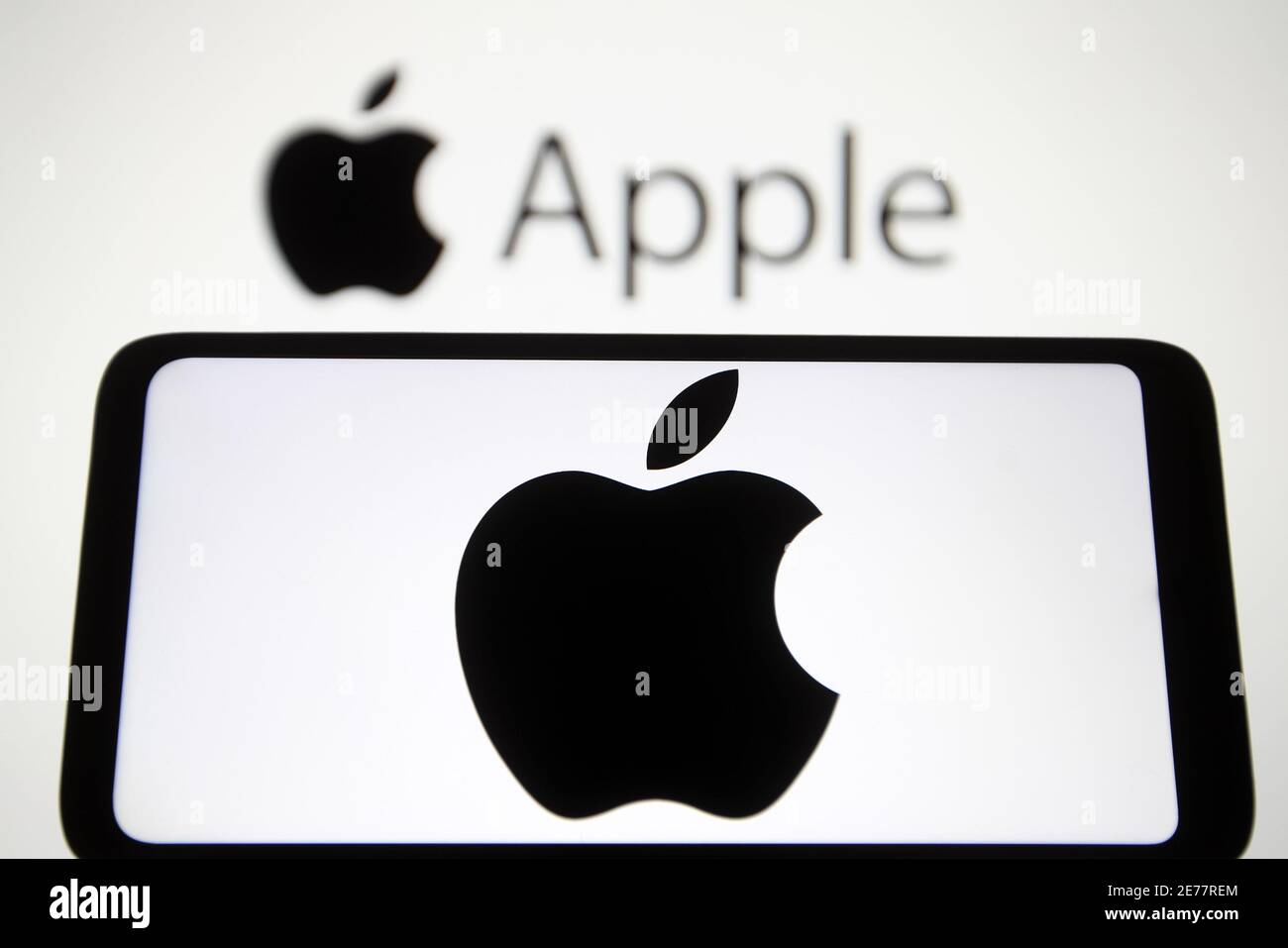 In this photo illustration an Apple logo seen displayed on a mobile ...