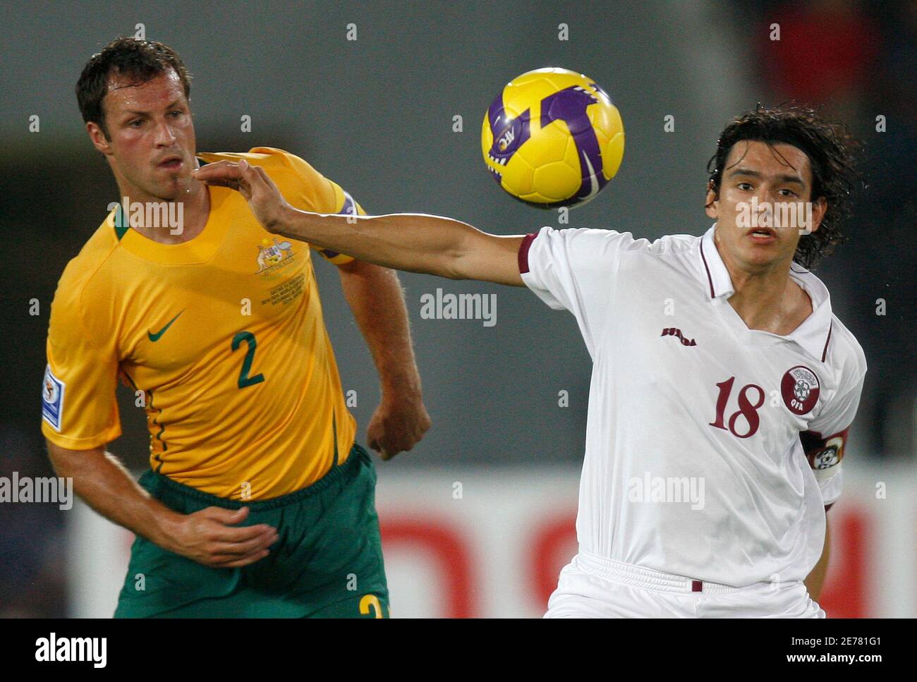 Australia S Lucas Neill Fights For The Ball With Qatar S Sebastian Soria R During Their 10 World Cup Qualifying Soccer Match In Doha June 6 09 Reuters Fadi Al Assaad Qatar Sport Soccer Stock Photo