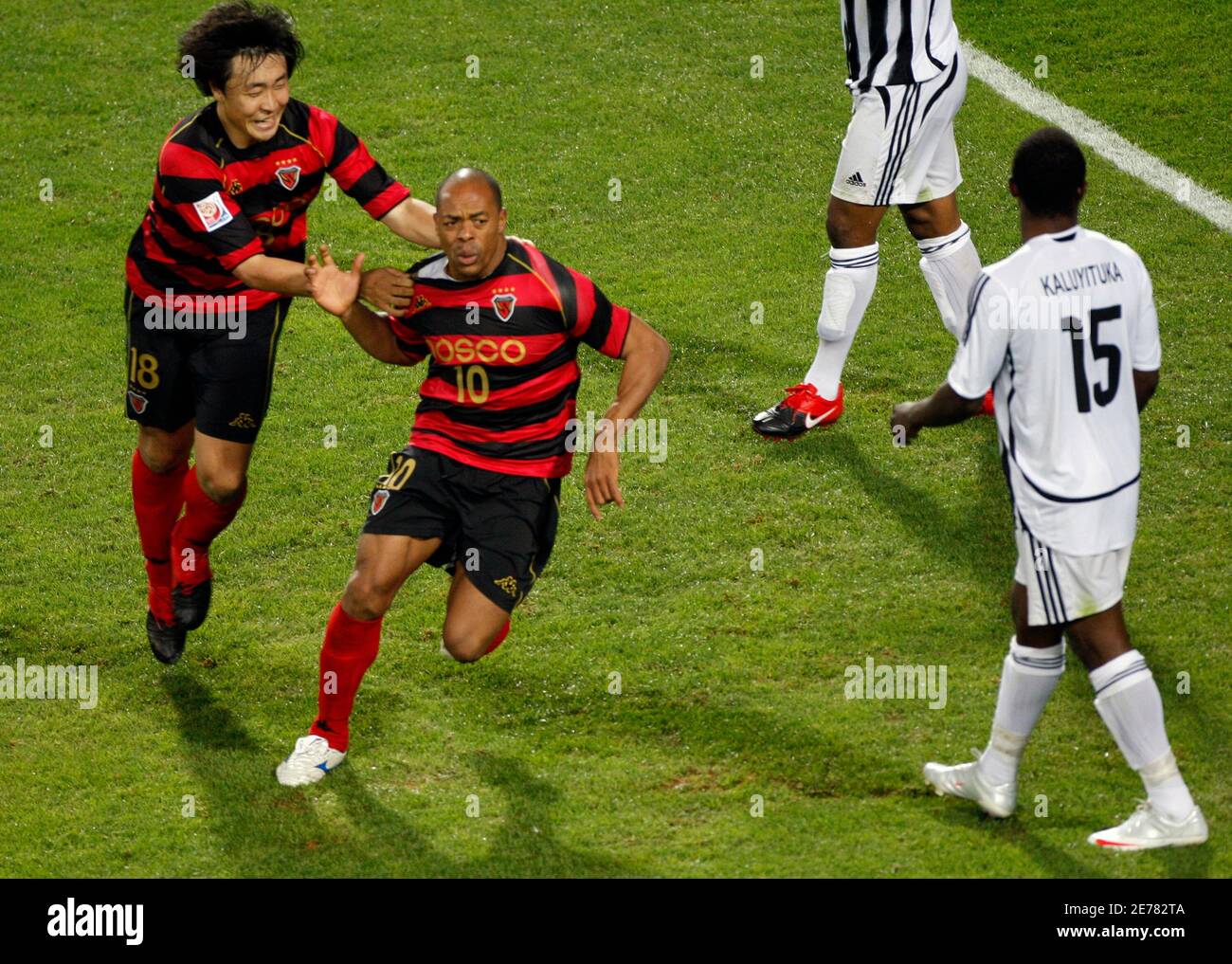 Pohang Steelers' Denilson (R) celebrates their FIFA Club World Cup  third-place playoff soccer match victory over Atlante at Zayed Sports City  stadium in Abu Dhabi December 19, 2009. REUTERS/Amr Abdallah Dalsh (UNITED