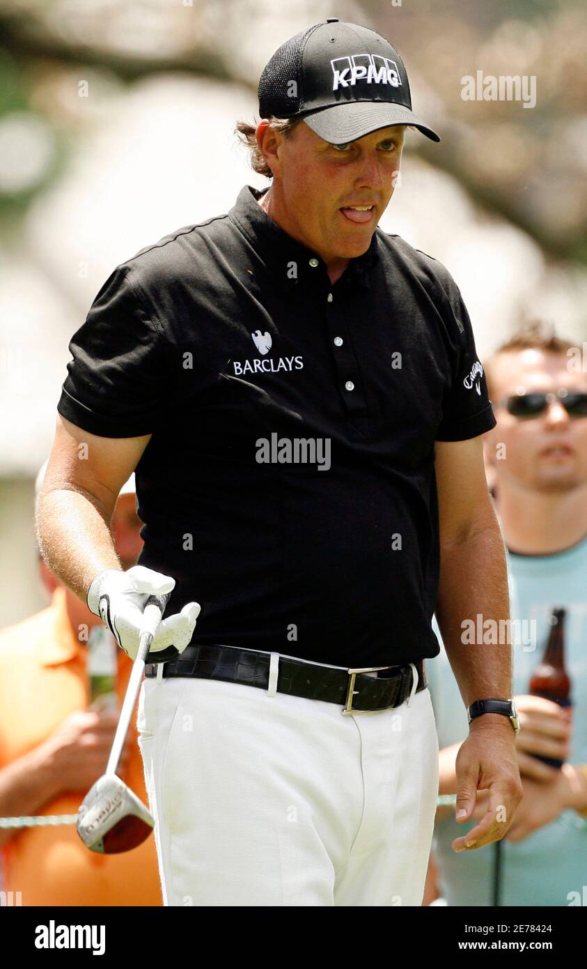 Phil Mickelson of the U.S. reacts to his drive at the third tee box during the final round of the Quail Hollow Championship in Charlotte, North Carolina May 2, 2010. REUTERS/Jason Miczek (UNITED STATES - Tags: SPORT GOLF) Stock Photo