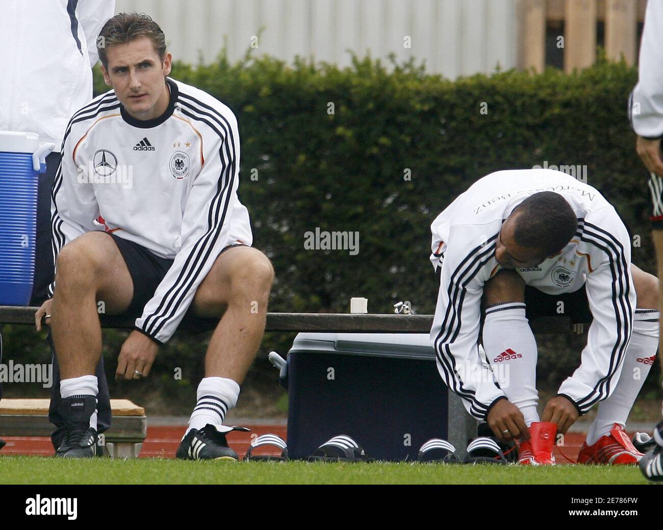 Germany S Miroslav Klose L And David Odonkor Put On Their Shoes During A Soccer Training Session In Kamen Near Dortmund August 15 06 The German National Soccer Team Will Play Against Sweden Germany S Miroslav Klose L And David Odonkor Put On Their Shoes During A Soccer Training Session In Kamen Near Dortmund August 15 06 The German National Soccer Team Will Play Against Sweden