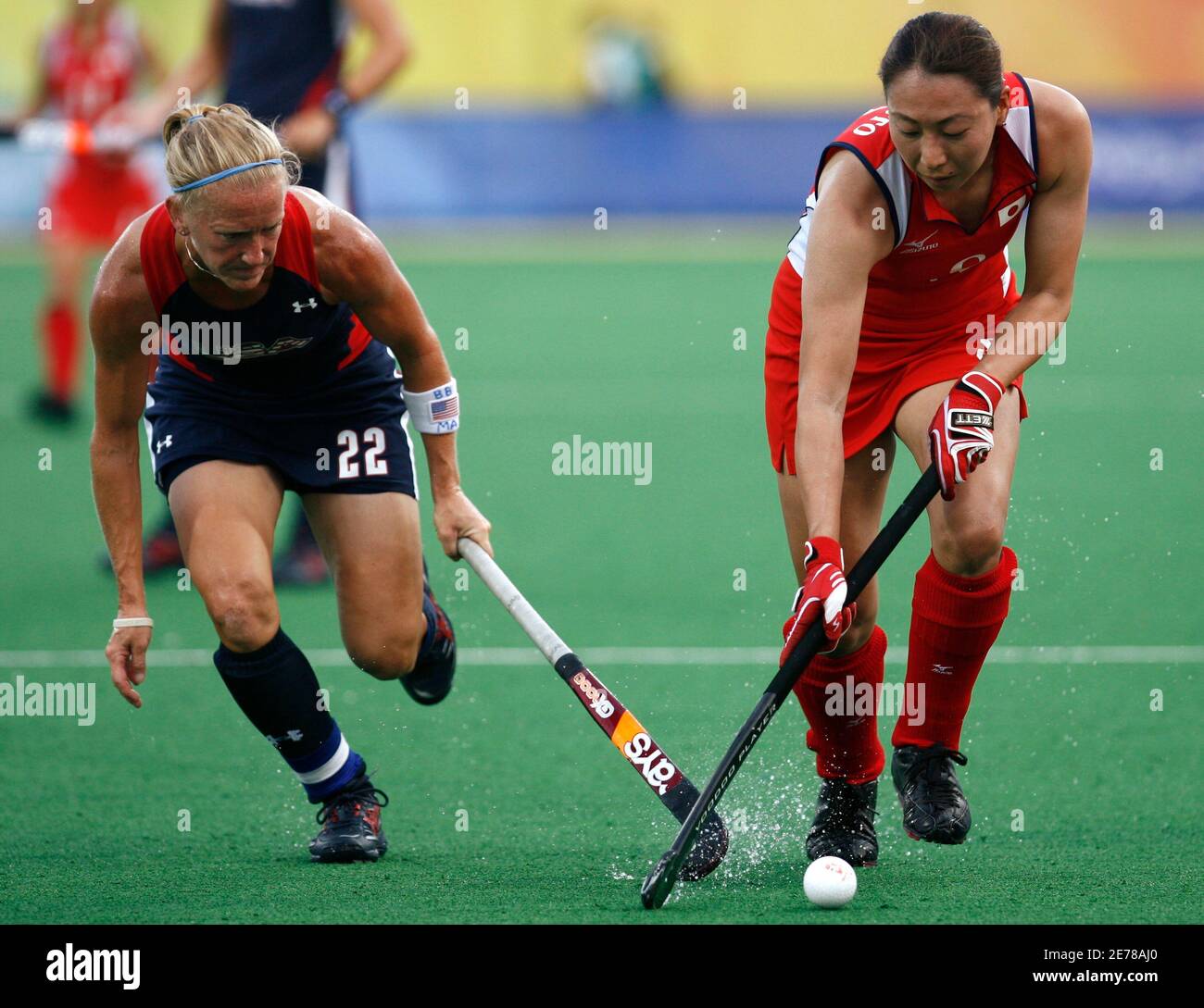 Sakae Morimoto Of Japan R And Kate Barber Of The U S Chase The Ball During Their Women S Pool Wb Hockey Match At The Beijing 08 Olympic Games August 12 08 Reuters Zainal Abd