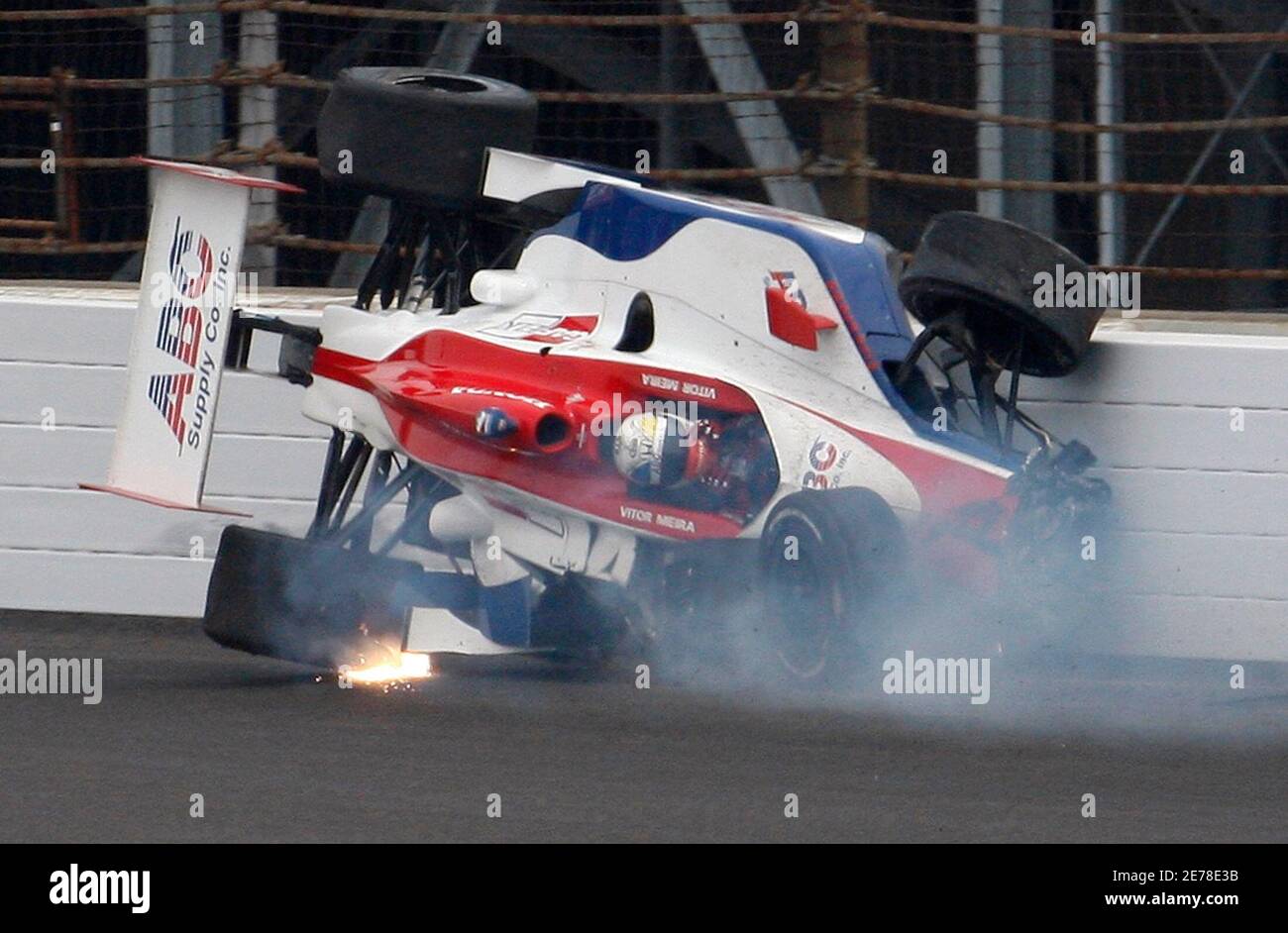 Vitor Meira of Brazil slides along the wall after crashing during the 93rd running of the Indianapolis 500 auto race in Indianapolis, Indiana, May 24, 2009.     REUTERS/Brent Smith (UNITED STATES SPORT MOTOR RACING) Stock Photo