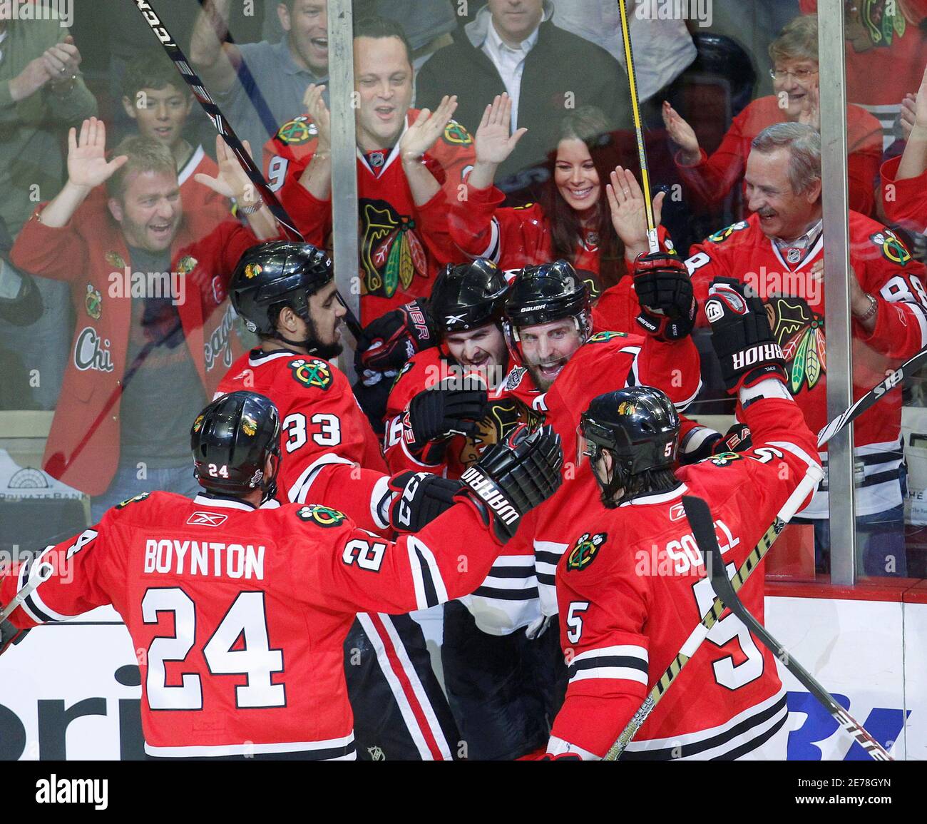 Actor Vince Vaughn and his wife Kyla Weber cheer in the background as  Chicago Blackhawks Dave Bolland (36) celebrates his goal with his teammates  in Game 5 of their NHL Stanley Cup