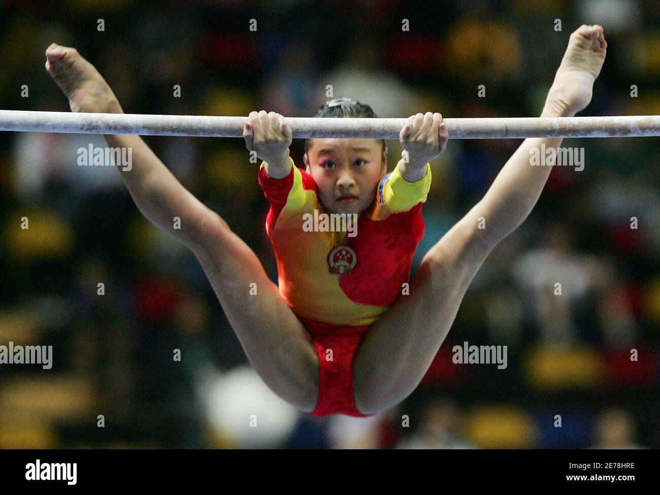 China's gymnast Li Ya performs on the uneven bars during the women's  gymnastics team final at the 4th East Asian Games in Macau October 31,  2005. China won the gold medal, while