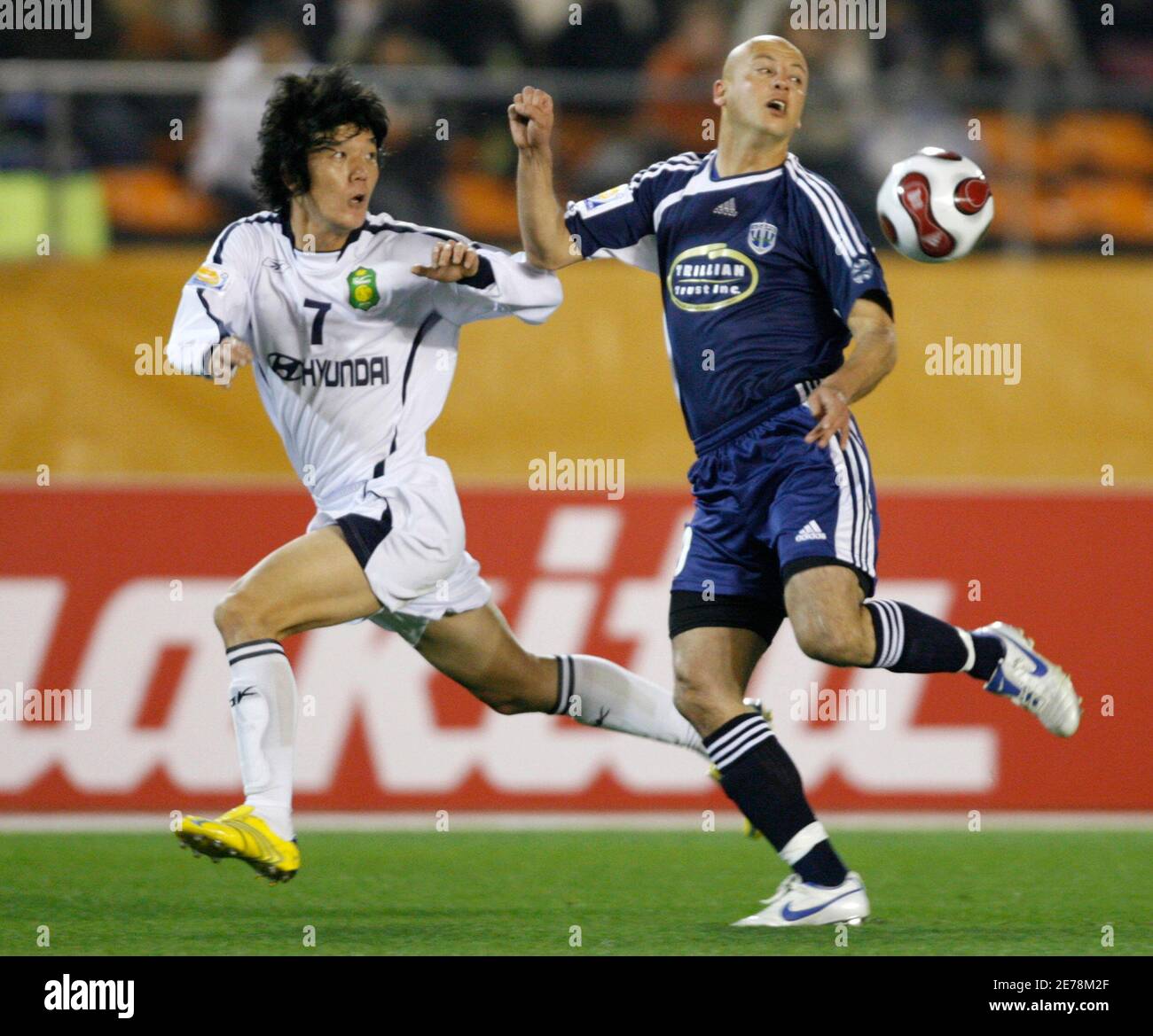 Chonbuk Motors Midfielder Jang Ji Hyun 7 Of South Korea Battles For The Ball Against Auckland City Fc Forward Grant Young Of South Africa During The Fifth Place Play Off Match Of The Fifa Club
