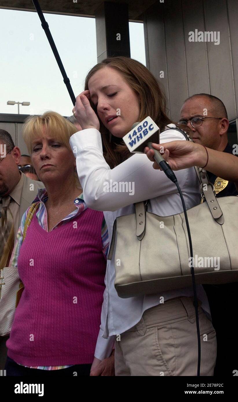 Whitney Davis (R), sister of Jessie Davis whose body was found in a shallow  grave, speaks with the media next to her mother Patty Porter, following a  court appearance by Bobby Cutts