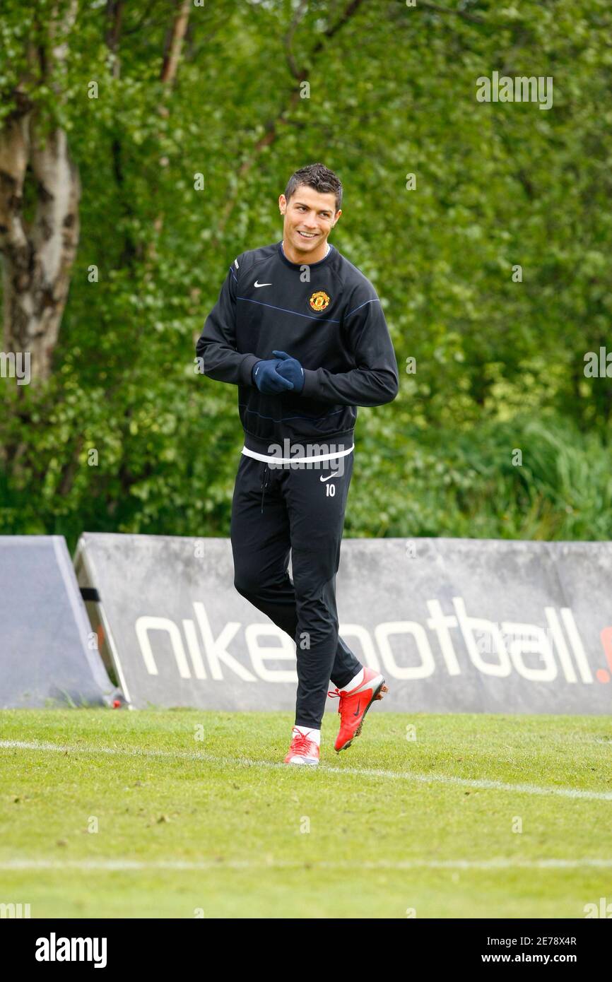 Manchester United's Cristiano Ronaldo smiles during a training session at  the club's Carrington training complex in Manchester, northern England, May  4, 2009. Manchester United are set to play Arsenal in their UEFA