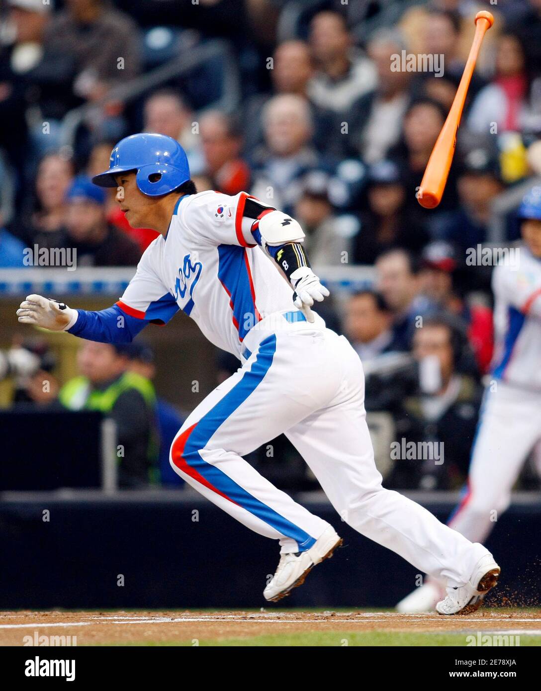 Jeong KeunWoo of Team Korea watches his single in the first inning