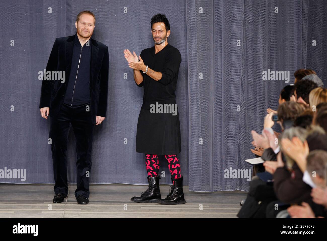 Designers Marc Jacobs (R) and Paul Helbers, for French fashion house Louis  Vuitton, appear at the end of their Fall/Winter 2009/10 men's ready-to-wear  fashion show at Paris Fashion Week January 22, 2009.