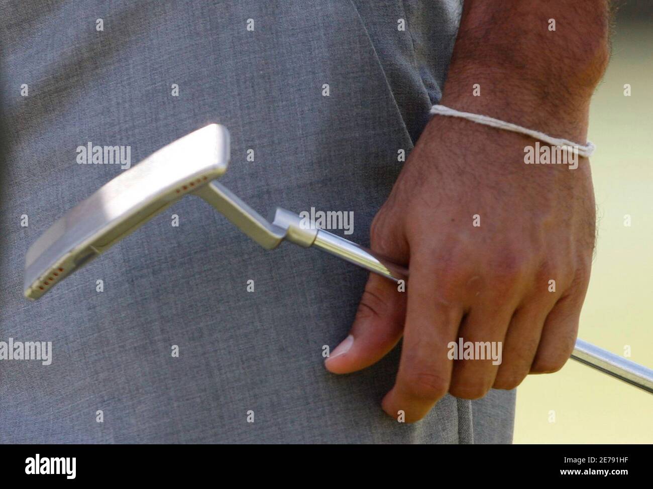 Tiger Woods of the U.S. wears a Buddhist bracelet during his practice round  for the 2010 Masters golf tournament at the Augusta National Golf Club in  Augusta, Georgia, April 6, 2010. REUTERS/Hans