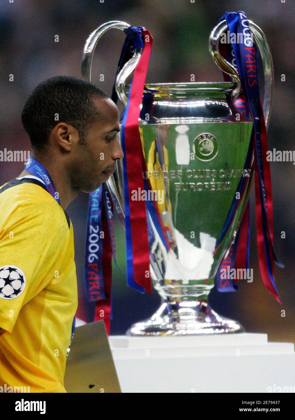 Arsenal's Thierry Henry of France walks past the Champions League trophy  after losing in the final soccer match against Barcelona at the Stade de  France in Saint Denis near Paris May 17,