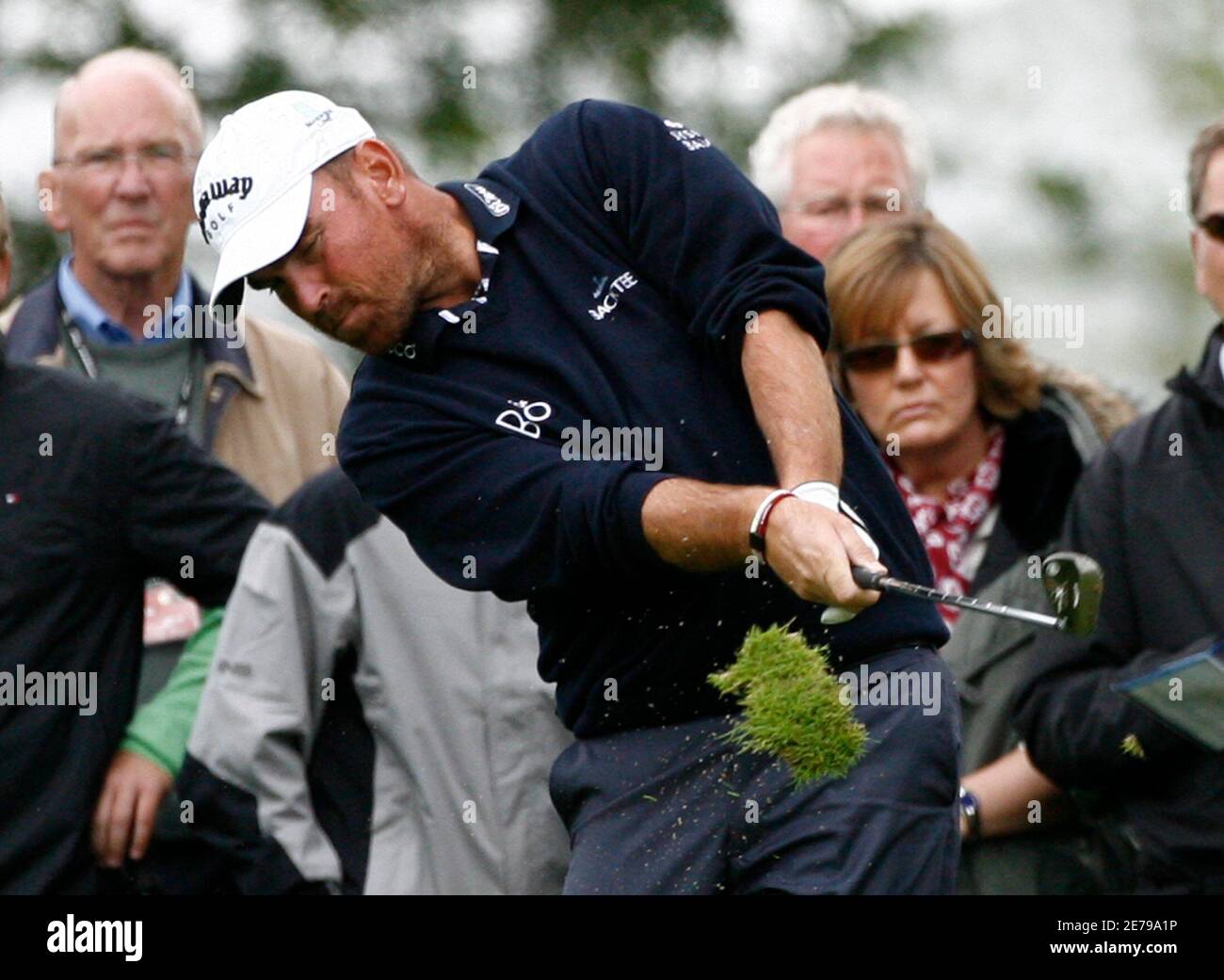 Denmark's Thomas Bjorn plays his second shot at the ninth hole during his second round of the Scottish Open golf tournament at Loch Lommond near Glasgow, Scotland, July 11, 2008. REUTERS/David Moir (BRITAIN) Stock Photo