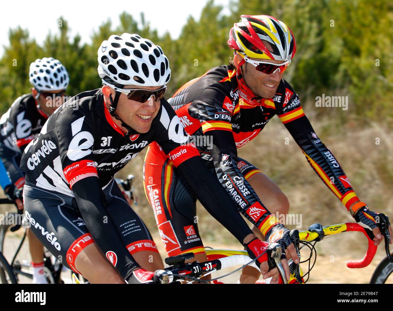 Caisse D'espargne rider Alejandro Valverde (R) and Cervelo Test Team rider  Carlos Sastre cycle during the third stage of the Vuelta de Castilla y Leon  cycling race between Sahagun and Estacion Invernal