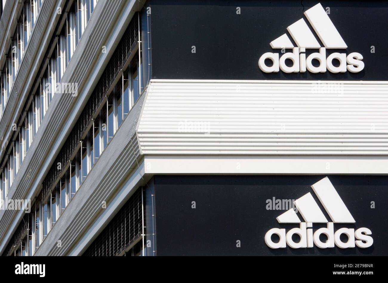 Adidias logos are seen on the company's building in Landersheim near  Strasbourg March 31, 2009. The Paris prosecutor plans to open an  investigation targeting Michelin, Total and Adidas over suspected tax fraud,