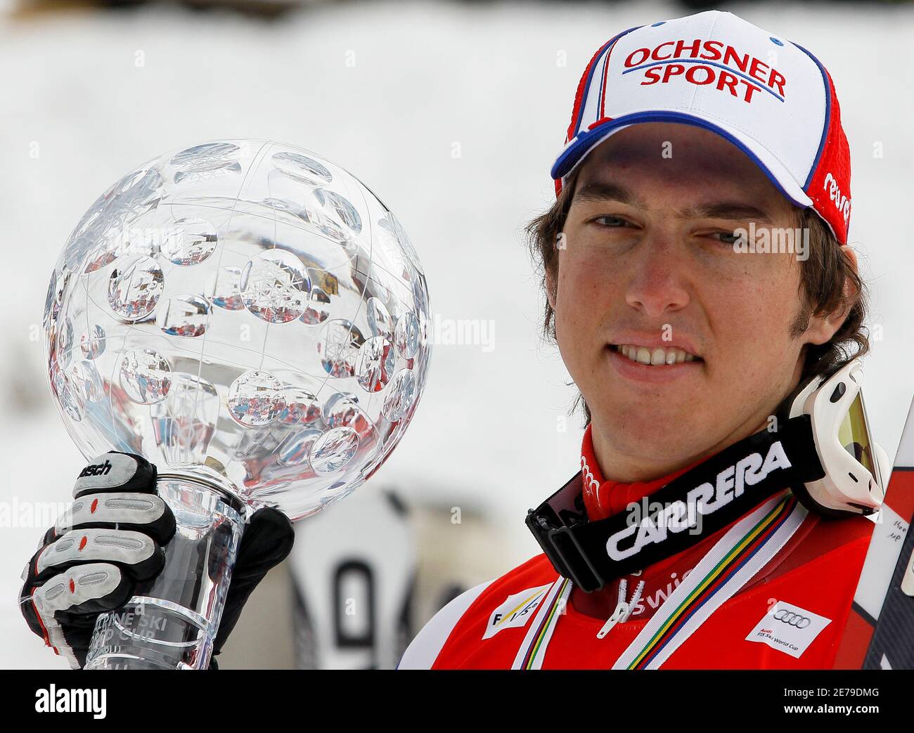 Carlo Janka of Switzerland poses with the men's overall Alpine Skiing World Cup trophy in Garmisch-Partenkirchen March 13, 2010.  REUTERS/Miro Kuzmanovic (GERMANY - Tags: SPORT SKIING) Stock Photo