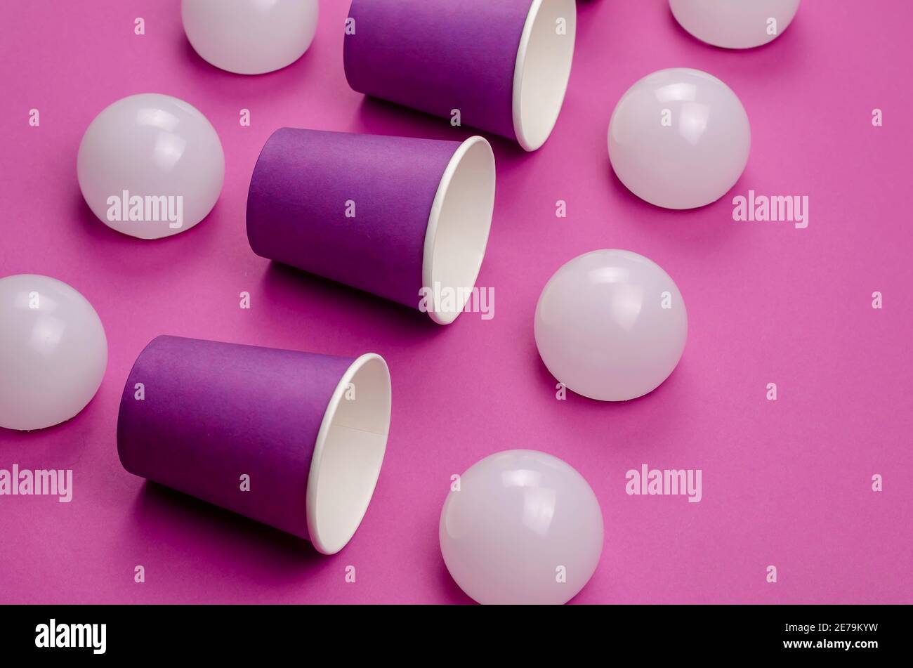 Creative geometric composition with paper cups and white spheres on a ...