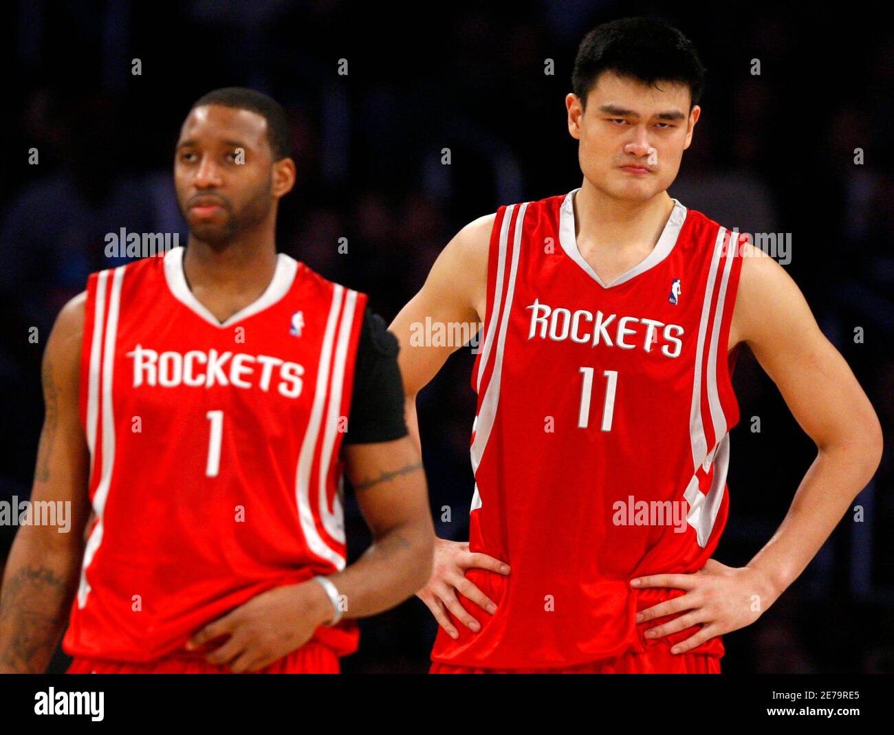 Houston Rockets' Yao Ming of China (R) and Tracy McGrady react during the  second half of their NBA basketball game against the Los Angeles Lakers in  Los Angeles November 9, 2008. REUTERS/Lucy