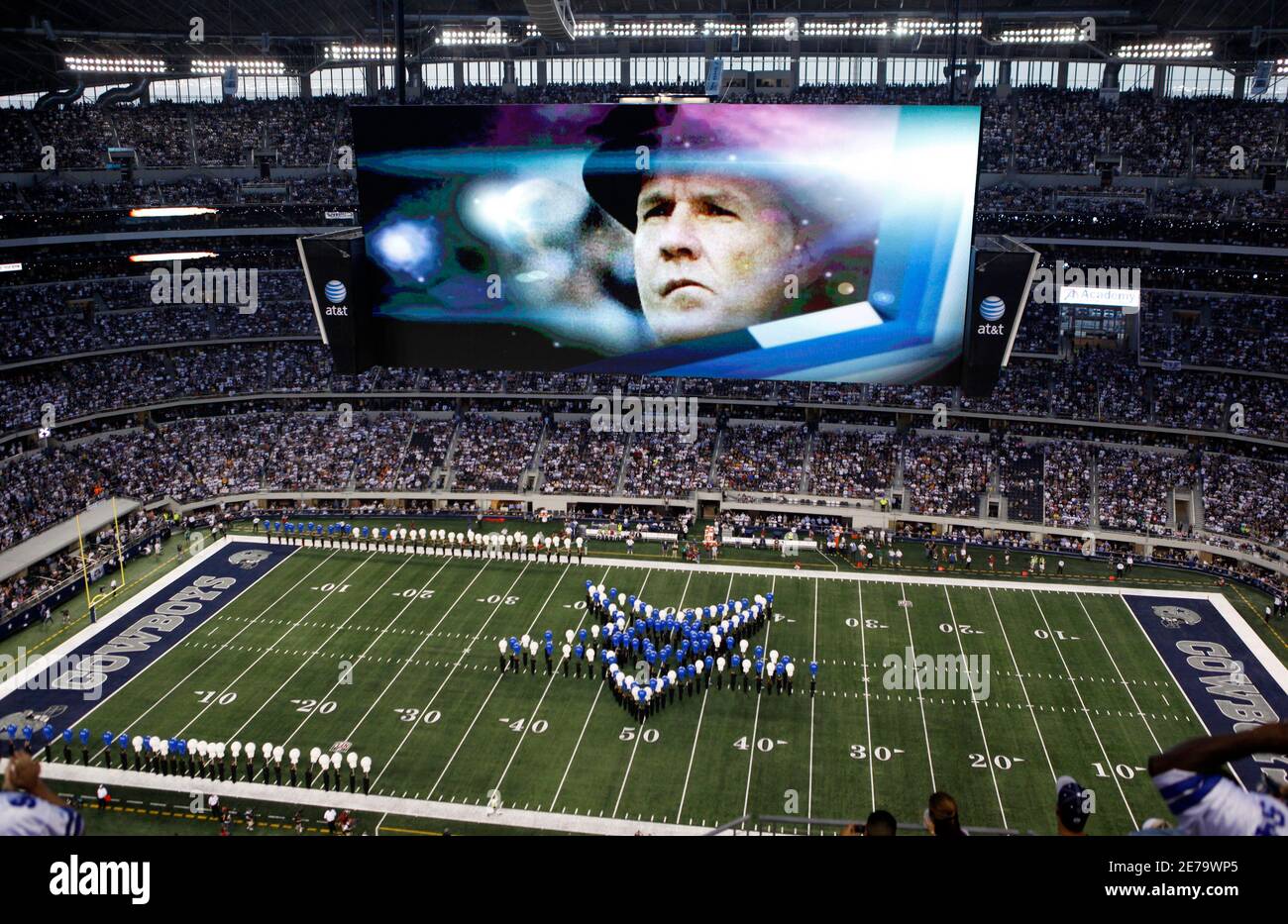 Dallas Cowboys former Coach Tom Landry's image is displayed on the giant screen at the Cowboys' NFL home opener game against the New York Giants in the new Cowboys Stadium, in Arlington, Texas, September 20, 2009.      REUTERS/Jessica Rinaldi (UNITED STATES SPORT FOOTBALL) Stock Photo