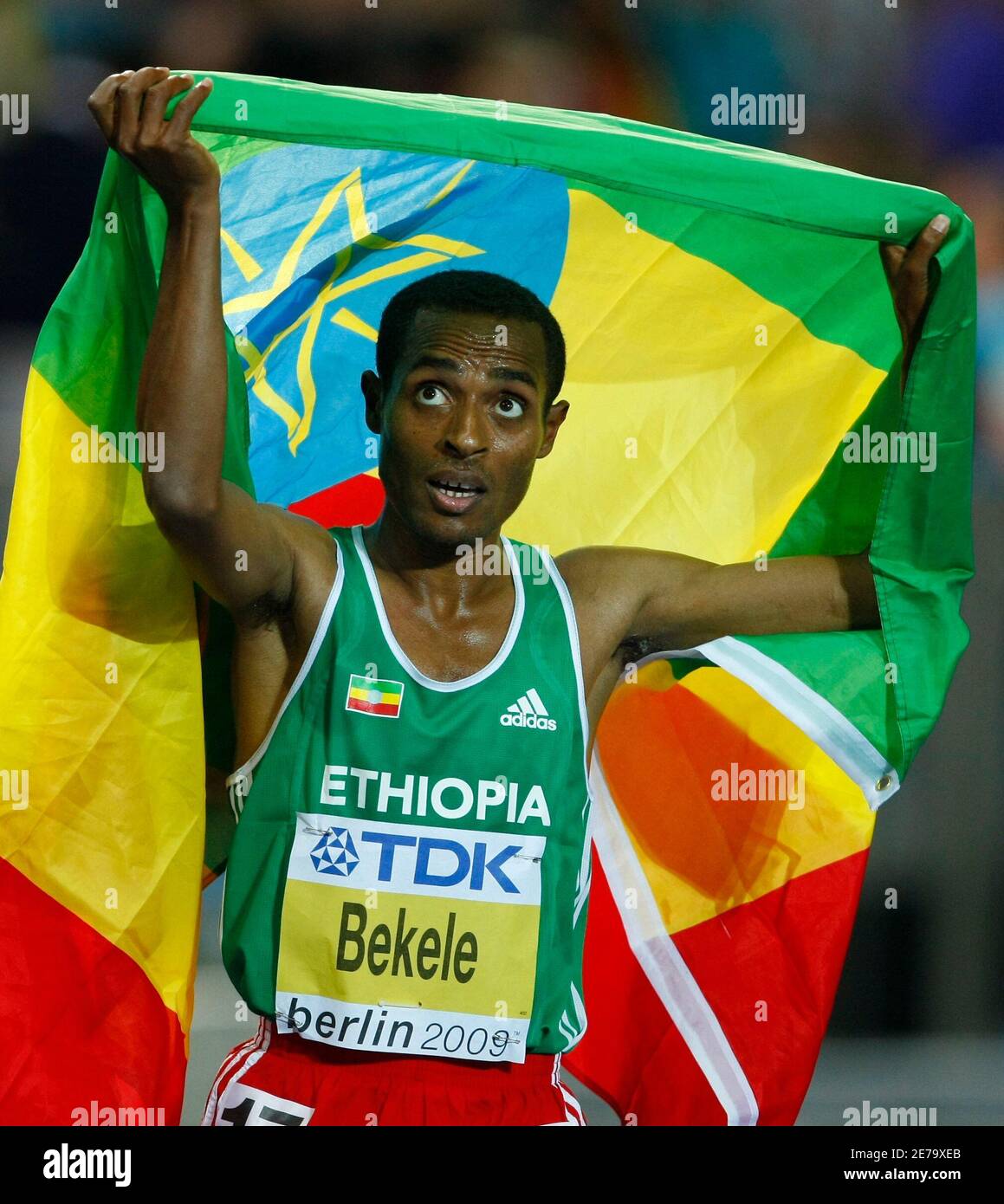 Kenenisa Bekele Of Ethiopia Holds His Country's Flag After Winning In ...