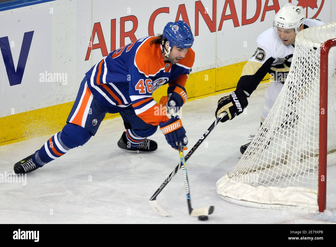 Edmonton Oilers' Zack Stortini (L) tries to score against ...